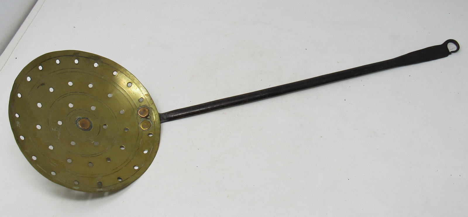 Brass and Wrought Iron Slotted Ladle: Approx 6 3/4" in diameter and 22 3/4" long