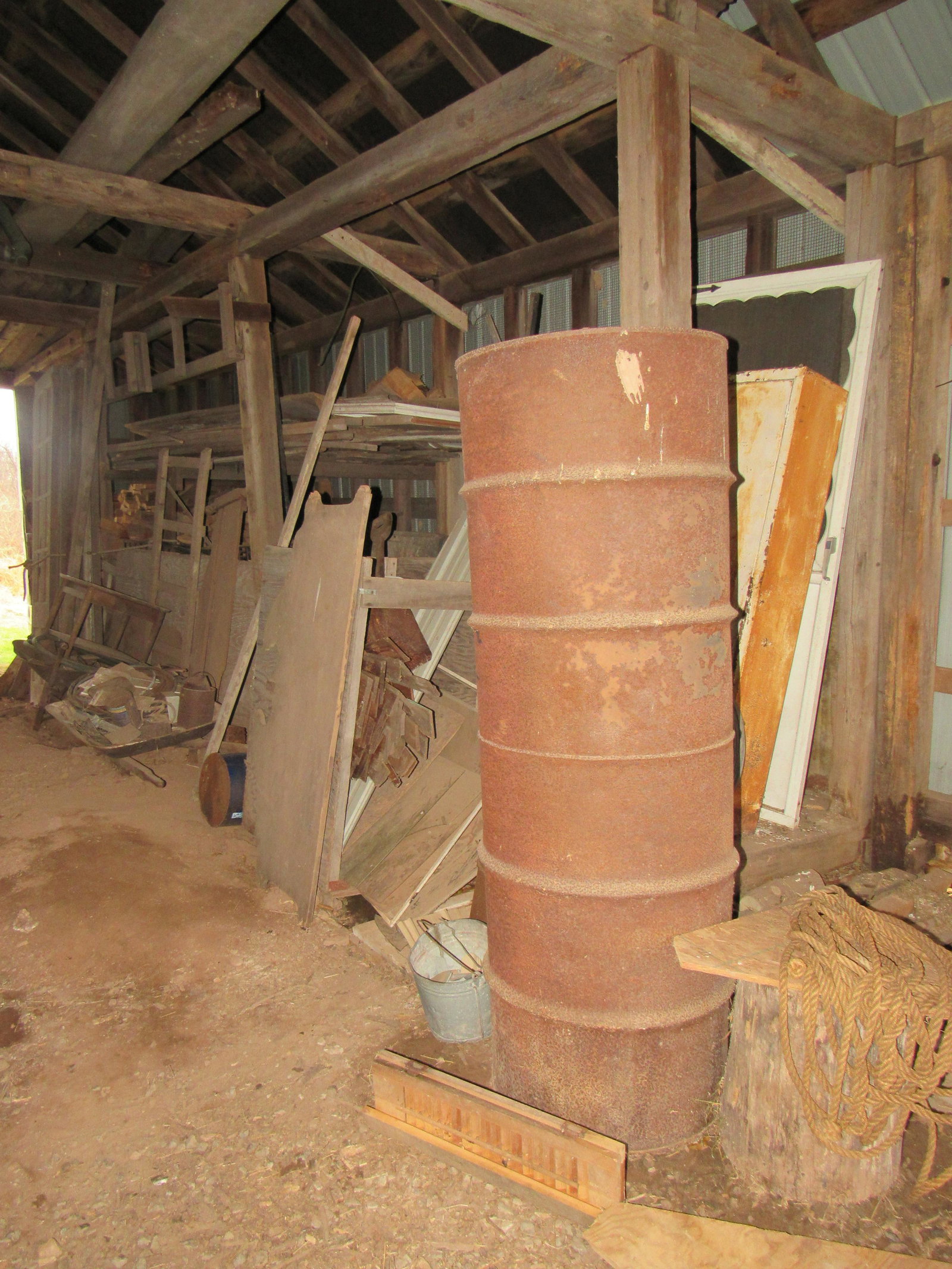 Partial Building Contents Including Galvanized Feed Box: Lot includes everything on right side wall of building ( EXCEPT DOORS THAT ARE IN NEXT LOT AND PILE OF CUT AND SPLIT FIREWOOD ). Take what you want and leave the rest