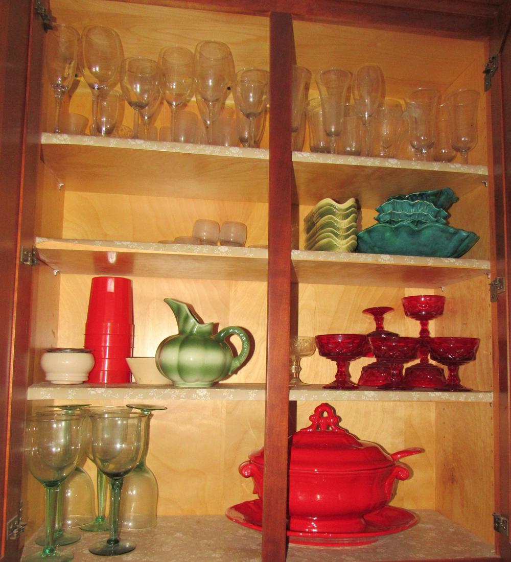 Glassware Misc Kitchen Cabinet Contents: Lot includes all in upper cabinets and the 4 prints. Take what you want and leave the rest