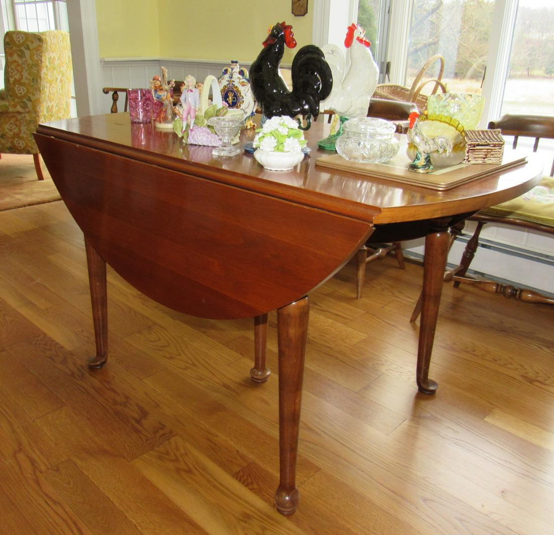 Style Drop Leaf Table w/ Queen Anne Legs: Apprx 29" (closed) x 53" . Comes with 3 leaves and table pad. Does not include items on it
