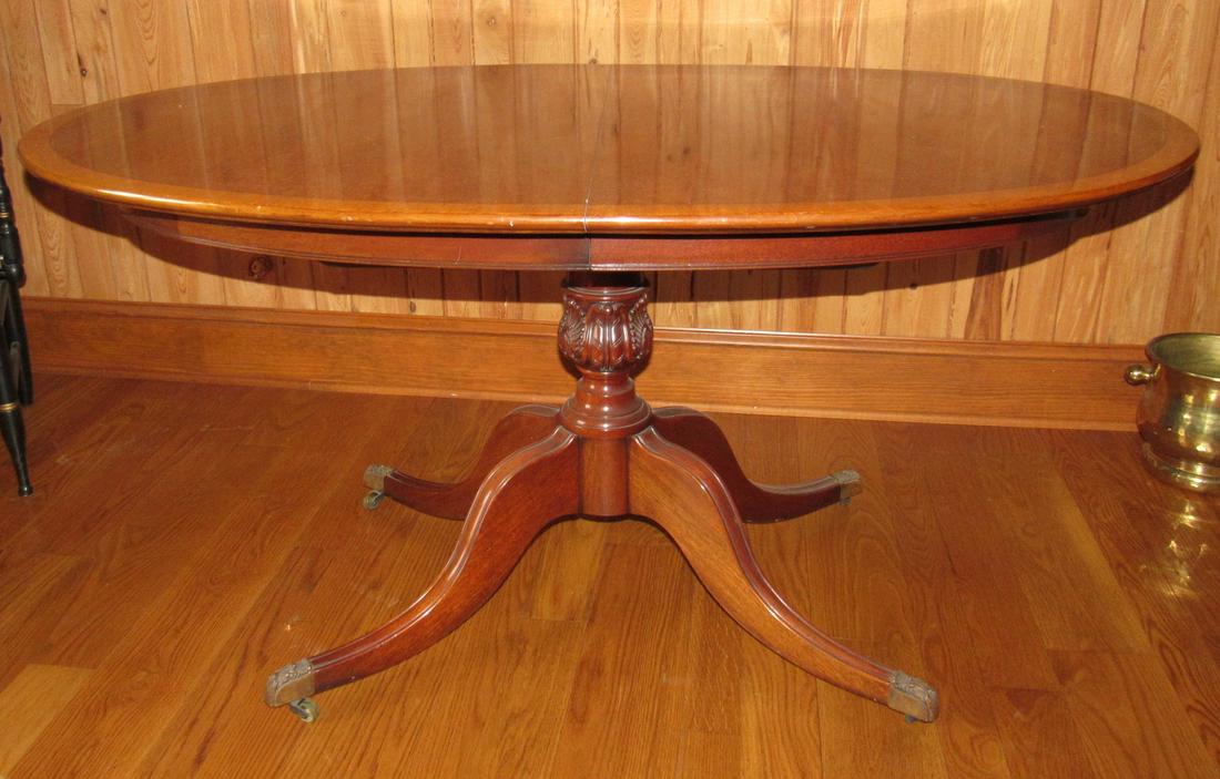 Duncan Phyfe Table: Approx 40" x 57 3/4" x 29 1/2" tall. Comes with 2 leaves and table pads