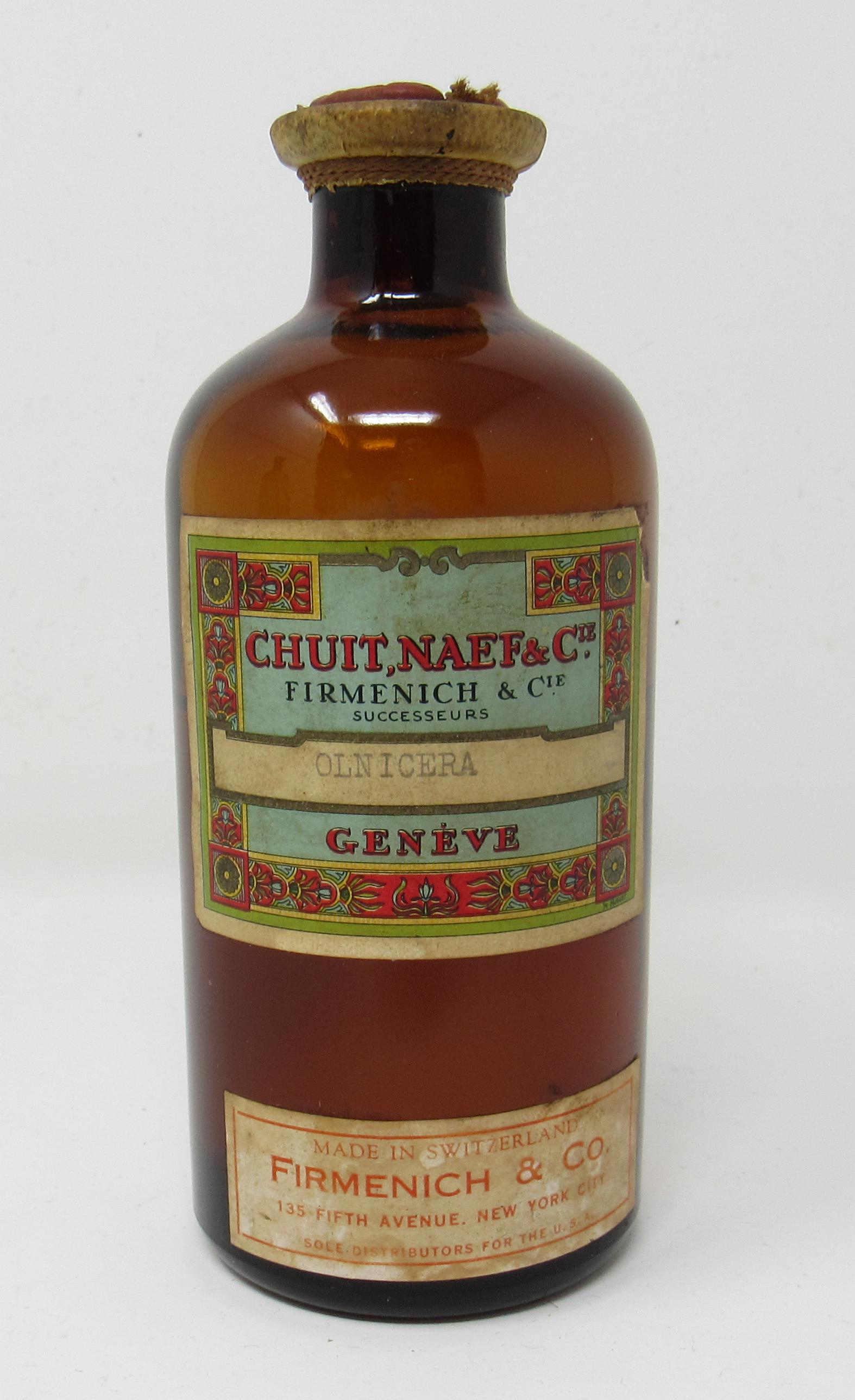 Firmenich Chuit Naef Geneve Perfume Bottle: Approx 5 1/4" tall. Has wax stamp and a little over half full.