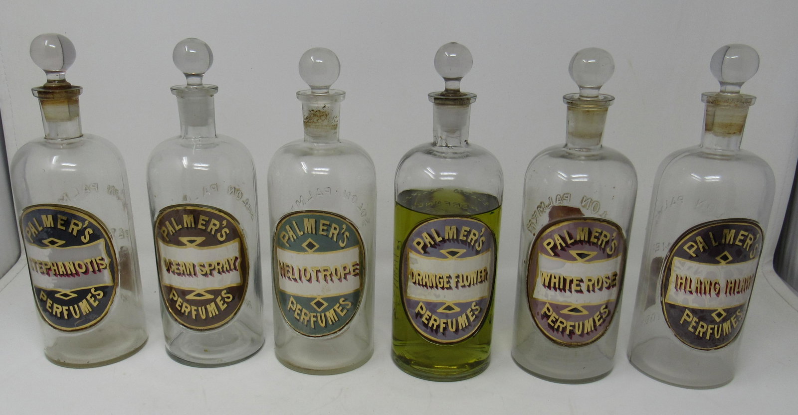 6 Palmer Perfumes Bottles: Approx 9" tall.