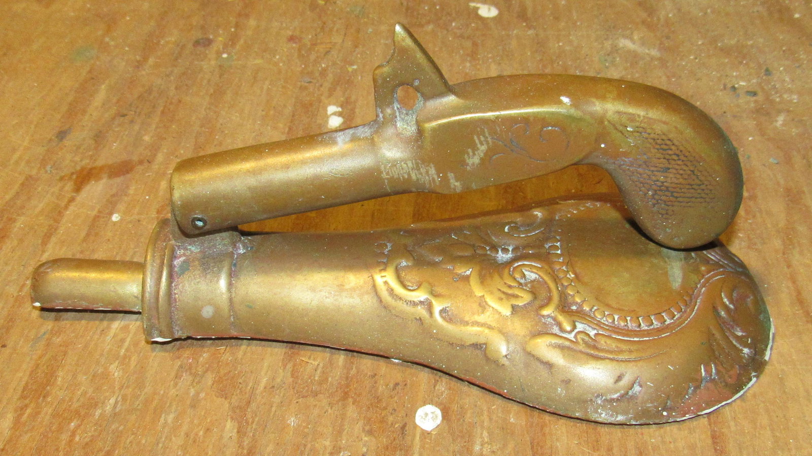 Brass Gun and Powder Flask Door Knocker: Approx 3 1/4" wide and 7 1/4" long