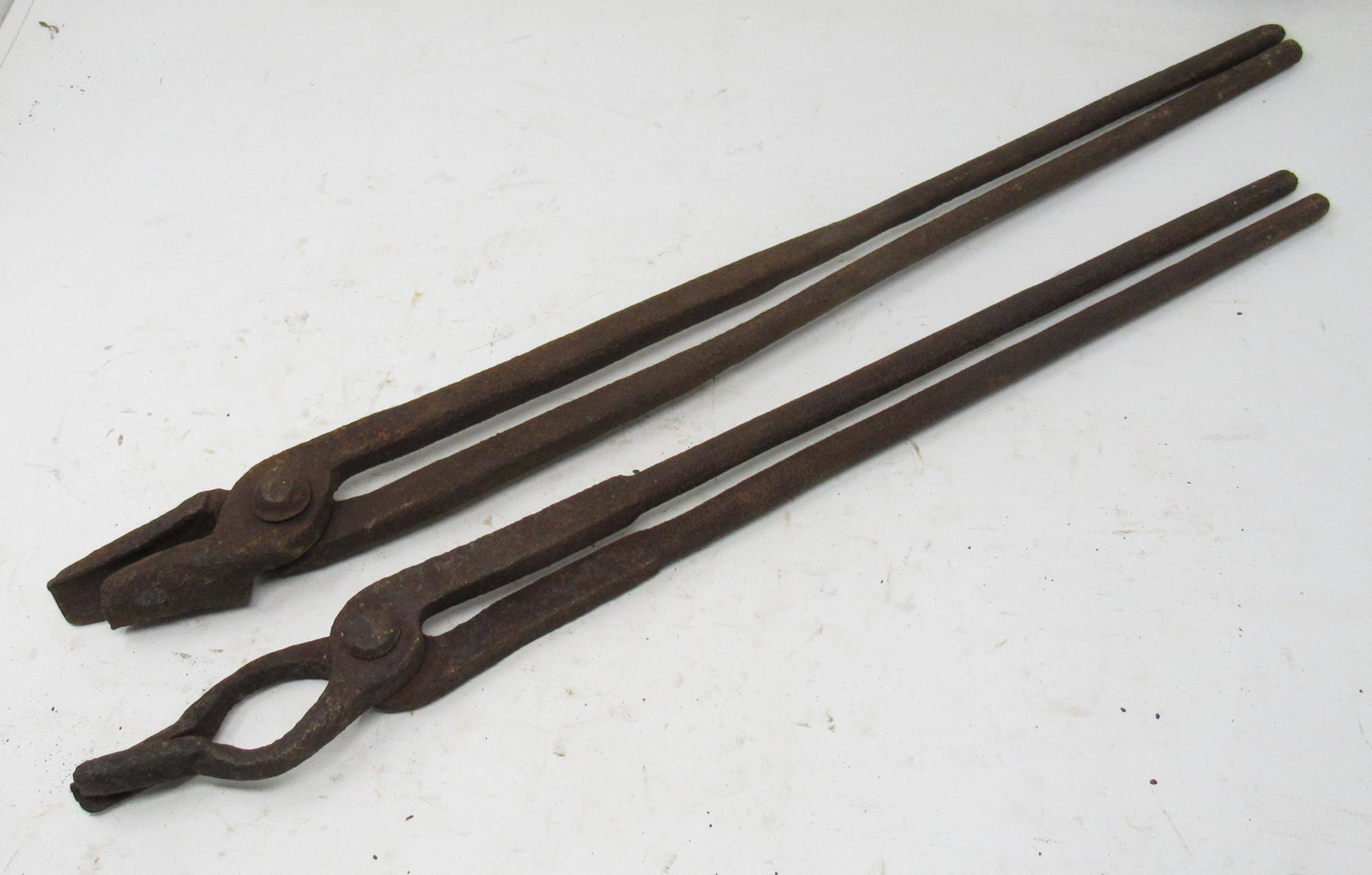 2 Pair of Blacksmith Tongs: Largest is approx 1" x 23 1/4" long.