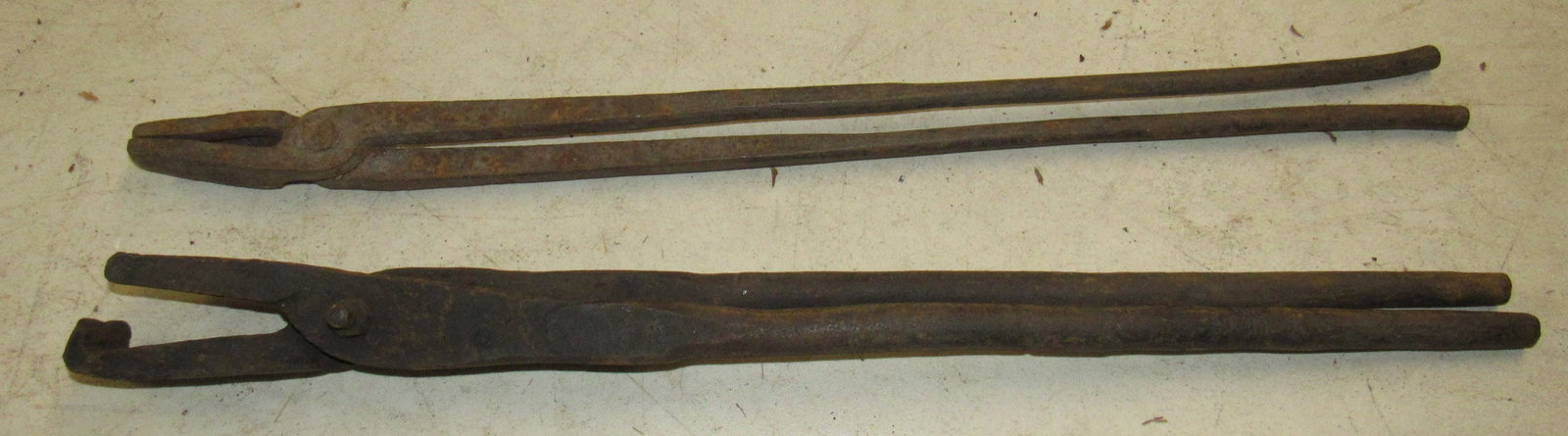 2 Pair of Blacksmith Tongs: Largest is approx 1 1/2" x 23"