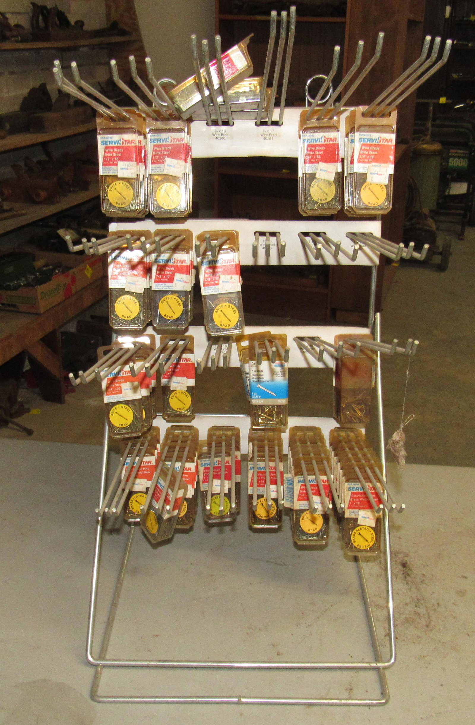 Hardware Store Display Rack w/ Brad Nails: Also has escutcheon pins and trim nails. Rack is apprx 12" x 24"