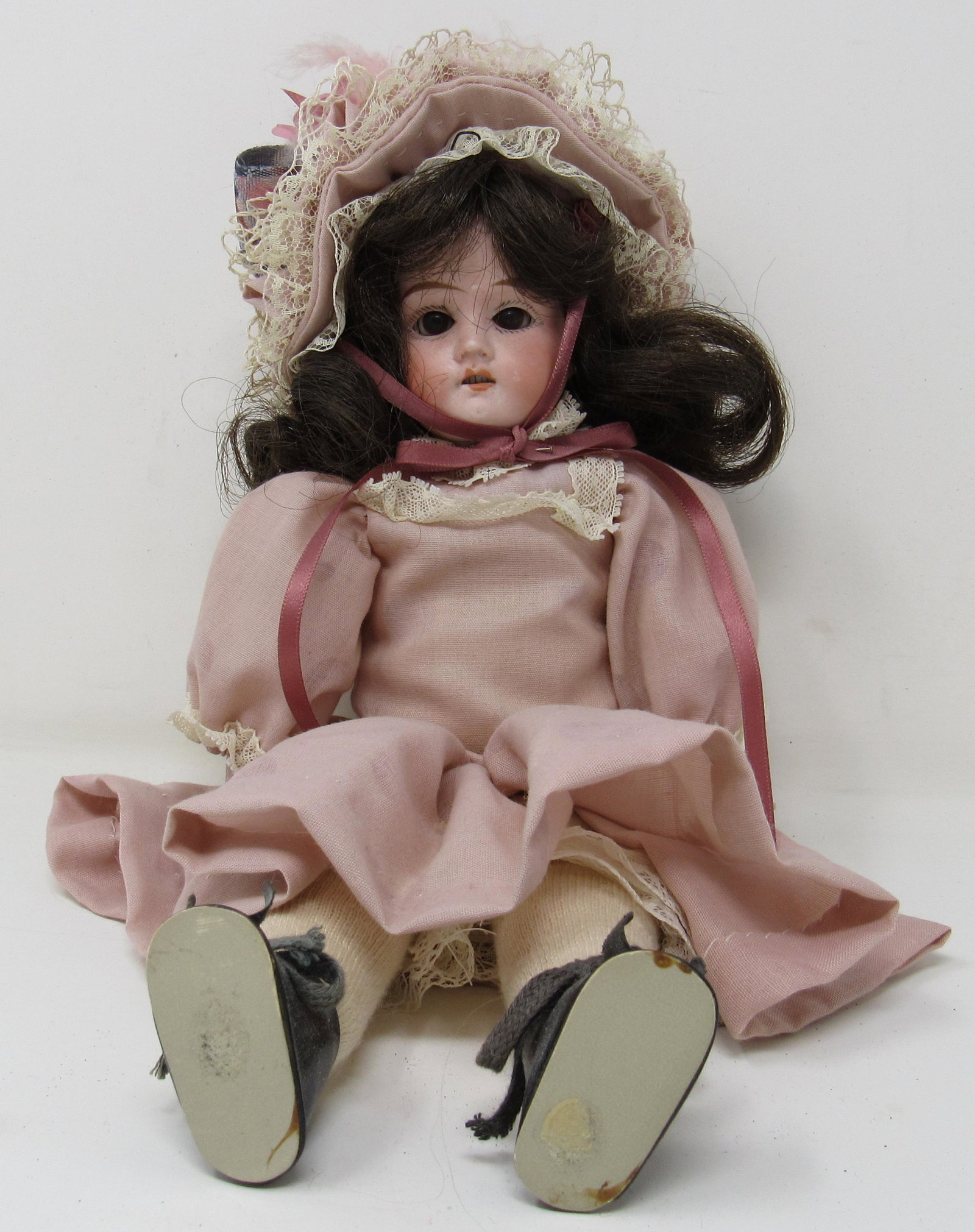 Germany Mabel Bisque Head Doll: Approx 12" long, with cloth body, sleepy eye , open mouth with teeth