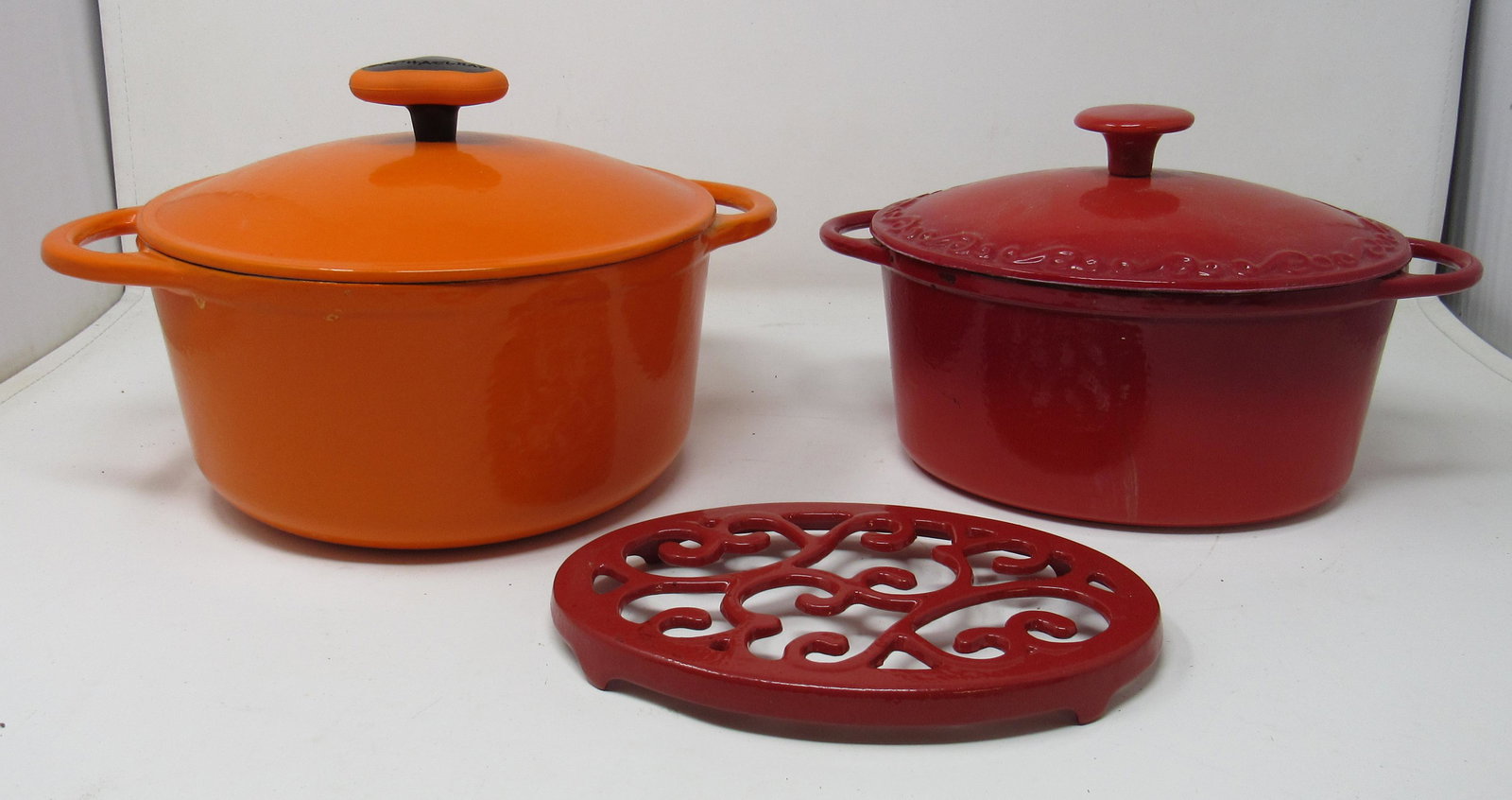 Rachael Ray & Technique Cast Iron Dutch Ovens: Rachael Ray ( orange) , is approx 8 1/2" in diameter and 4 1/2" tall.