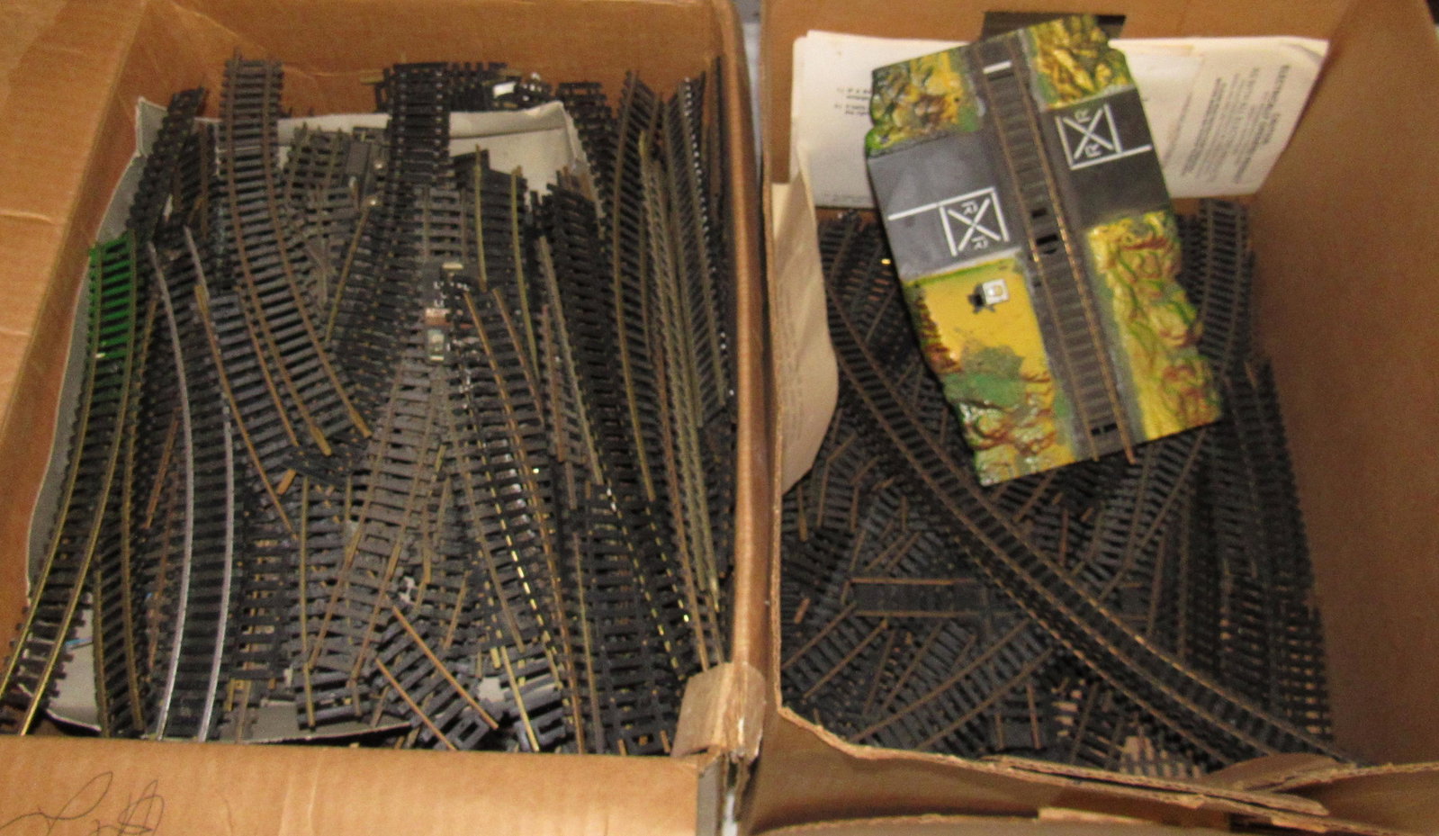 HO Scale Train Track: The larger box is approx 12 1/2" x 15 1/2" x 8 1/2" tall. That box is full. The other box has very few pieces in it