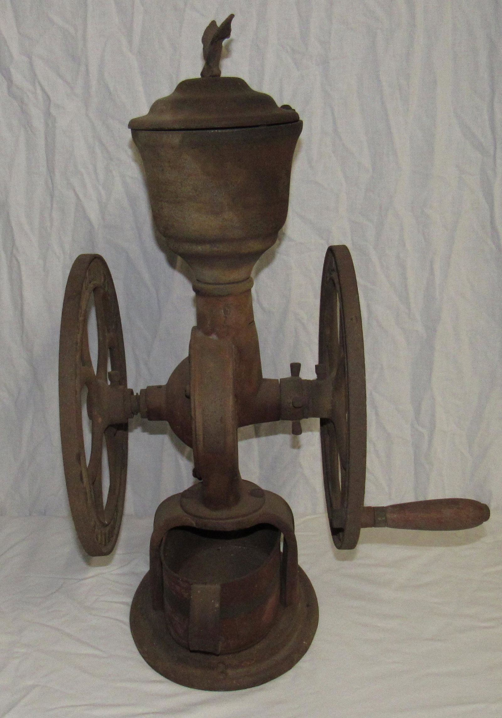 Antique Elgin National Coffee Mill: Total height is approx 24" . Wheels are approx 12" in diameter. On inside of wheels it has Woodruff and Edwardc Co.