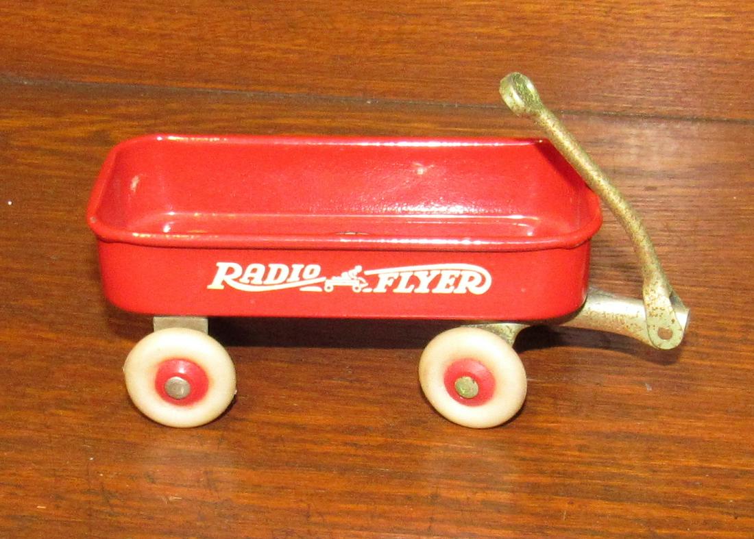 Vintage Miniature Radio Flyer Radio Line Wagon: Approx 2" x 4" x 1 3/4" tall.