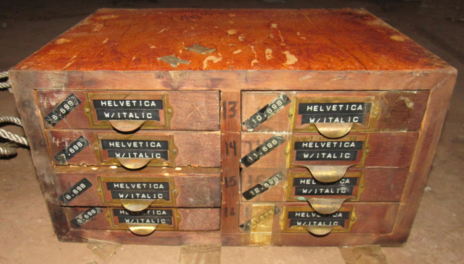 8 Drawer Printers Cabinet with Brass Linotypes: Approx 12" x 16 1/2" x 8 1/2" tall. Seems to be full, but we can not open the drawers