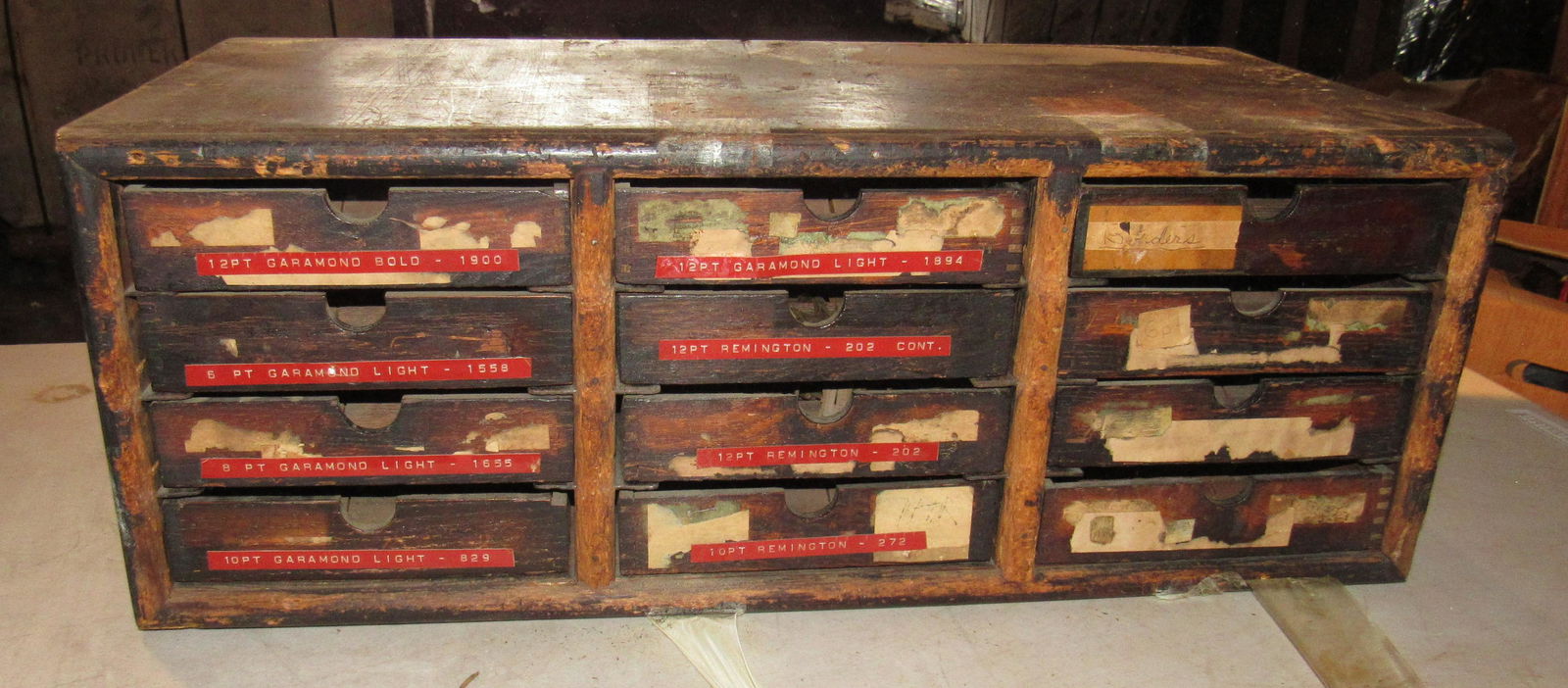 12 Drawer Printers Cabinet with Linotypes: Approx 12" x 24 3/4" x 9 1/4" tall.