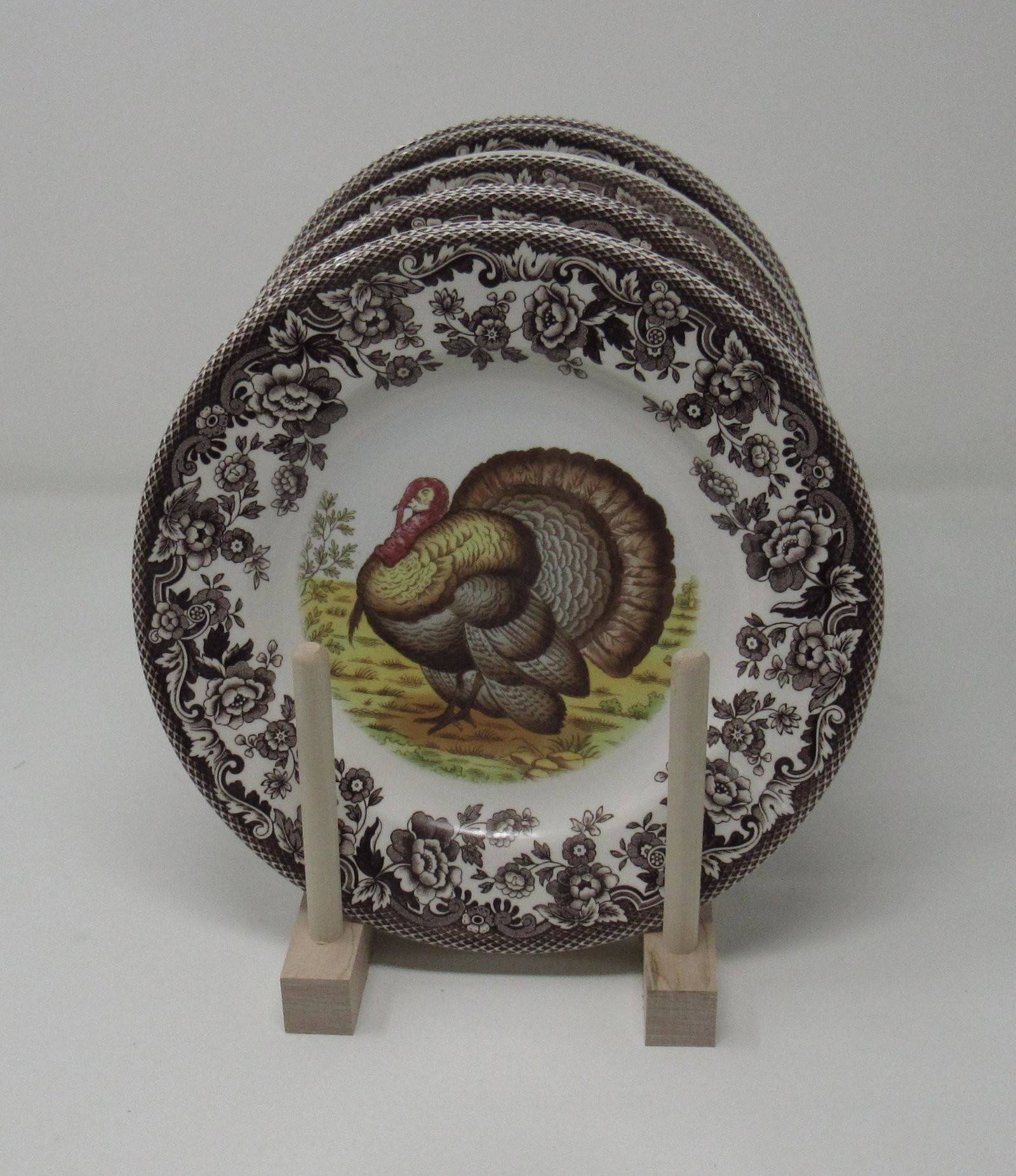 4 Spode Woodland Turkey 6 Delamere Plates: Comes with rack. Plates are approx 7 3/4" in diameter