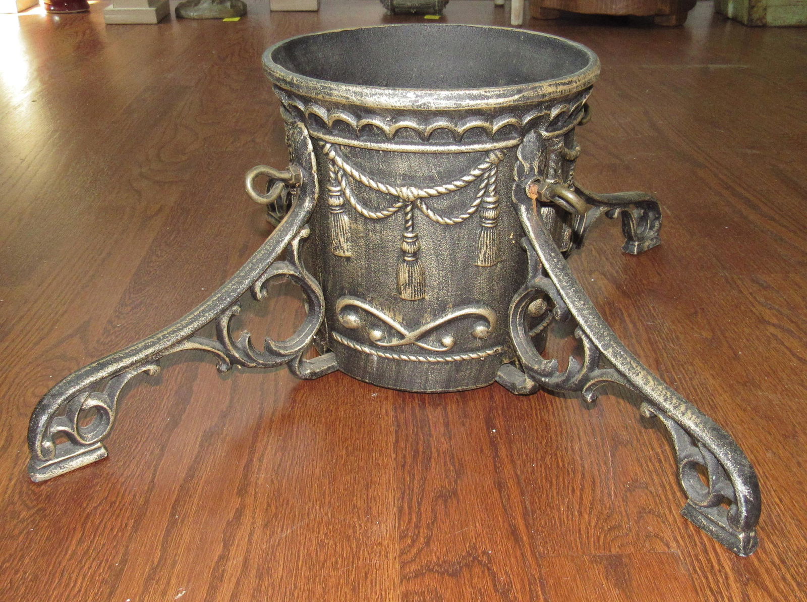 Cast Iron Christmas Tree Stand: Approx 8" inside diameter for tree, 24" in outer diameter ( leg to leg), and 9 1/2" tall