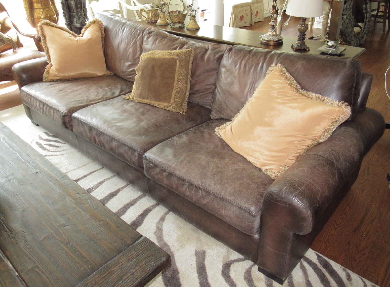 Leather Sofa: Approx 9' long, 42" deep, and 18" to seat