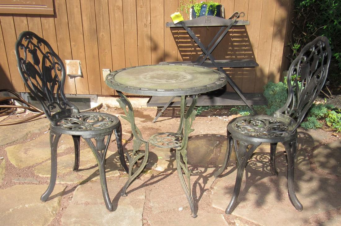 Cast Patio Chairs and Table: Table is approx 23" in diameter and 27" tall.