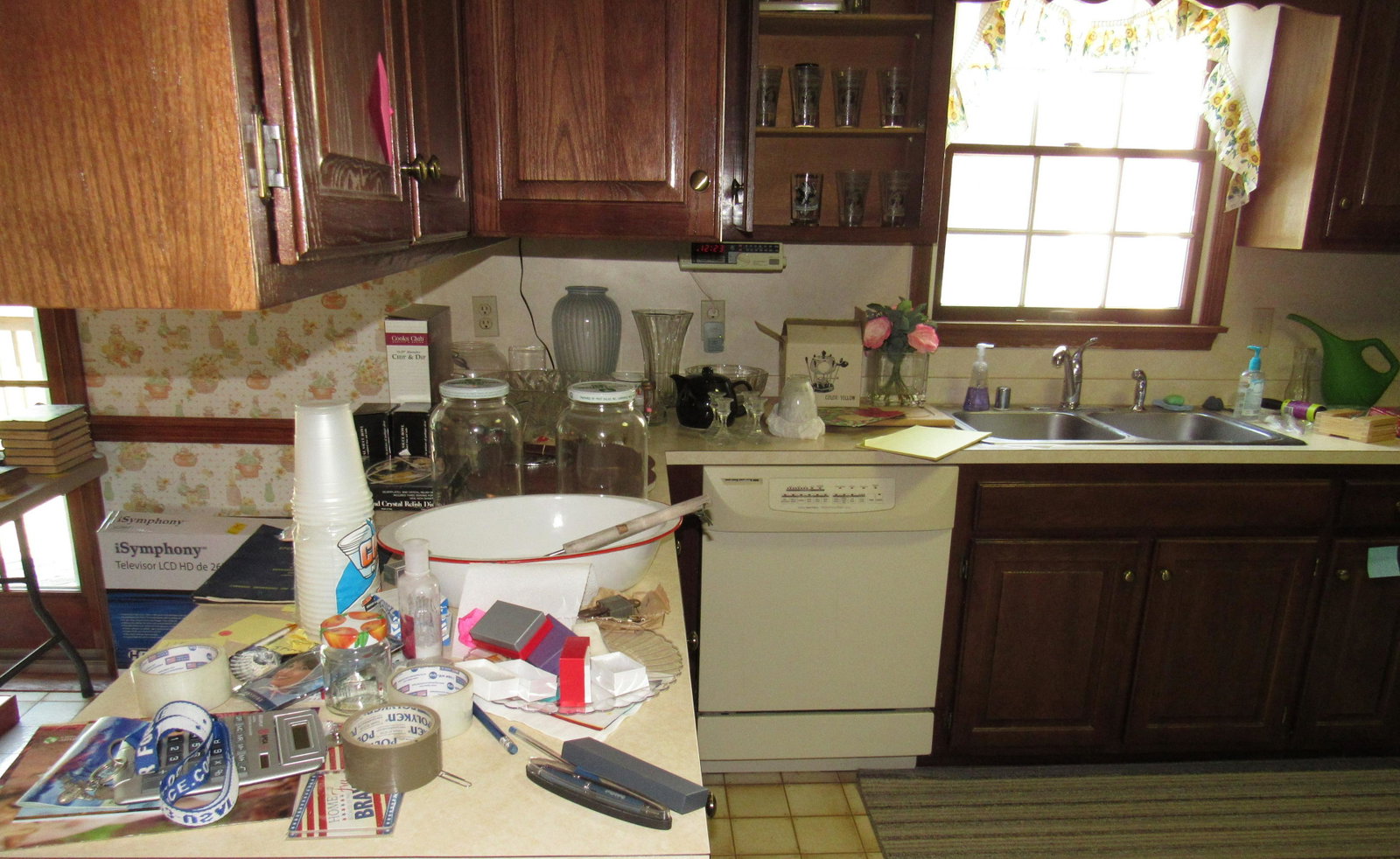 Partial Kitchen Contents: Lot includes everything on counter , bottom cabinets ( on left side of kitchen), and upper cabinets to left of sink . Corelle Ware, Coke Glasses. Take what you want and leave the rest