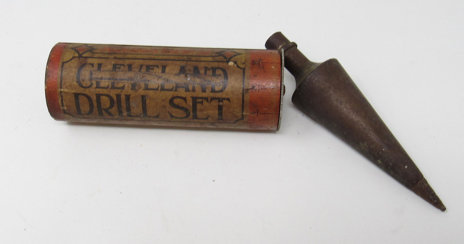 Brass Plumb Bob and Cleveland Drill Bit Holder: Drill bit case has some drill bits in it. Plumb bob is approx 5 1/4" long