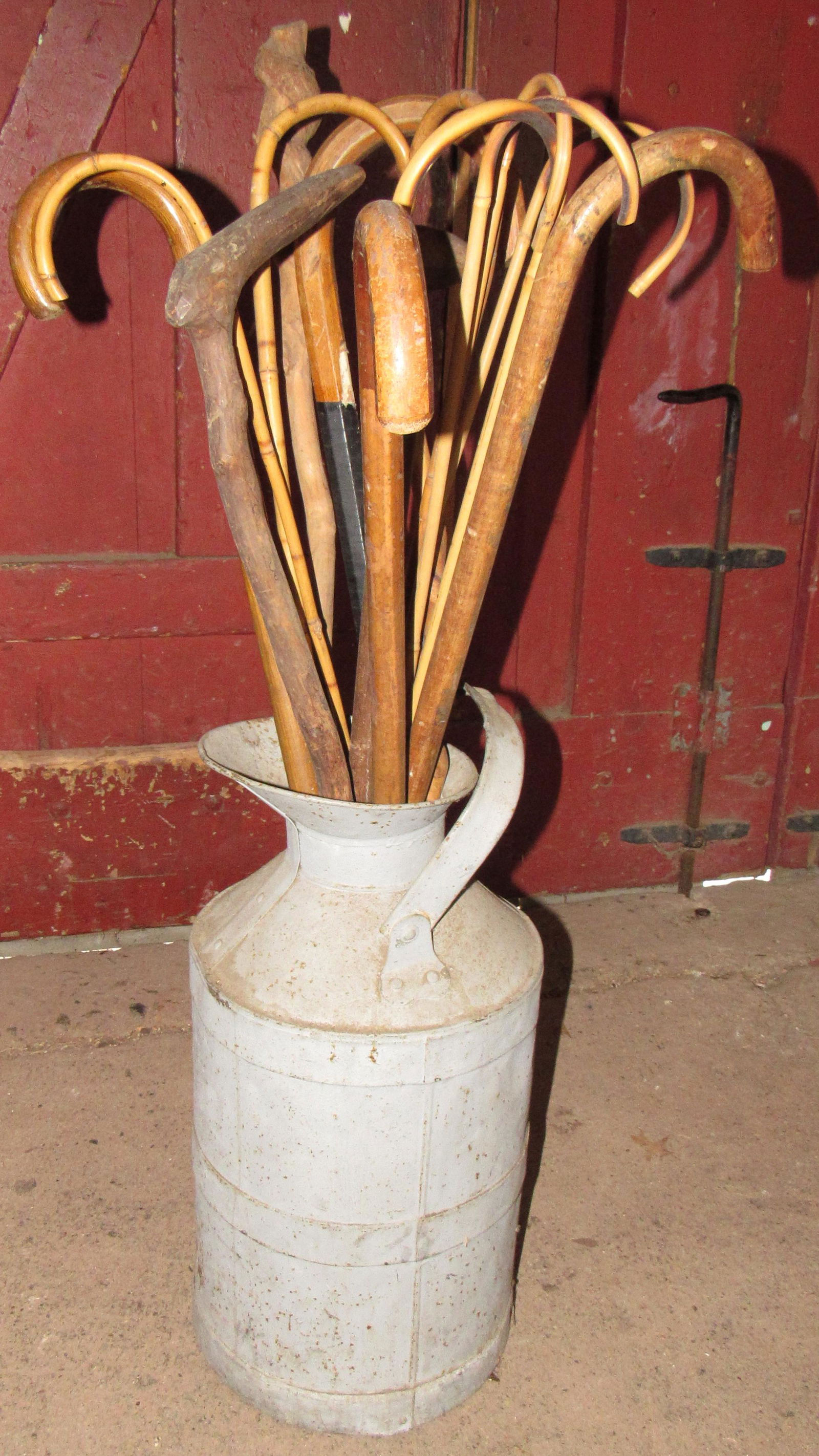 Milk Can with Canes and Walking Sticks: Milk Can is approx 10" in diameter and 22" tall.