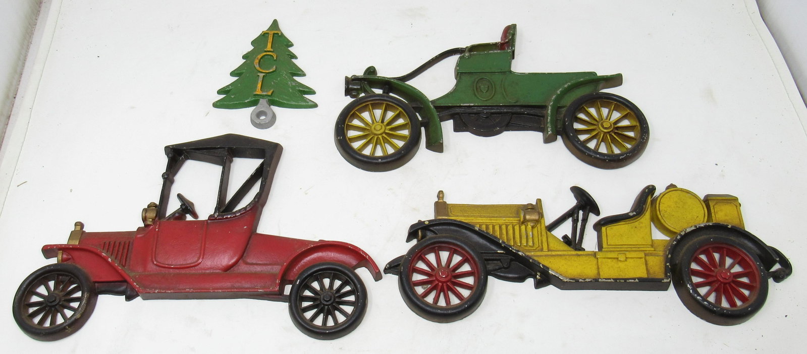Cast Aluminum Sexton Car Wall Plaques and Christmas: Cars are apprx 12 1/2" long. Tree is not marked