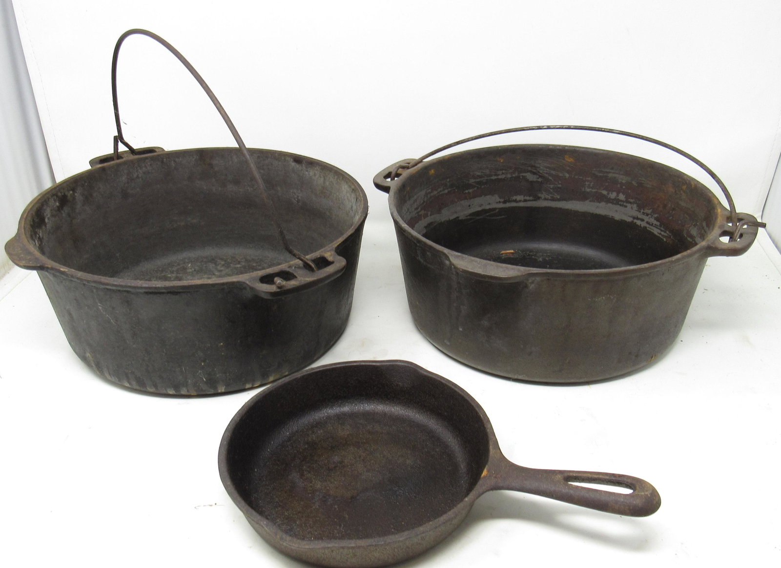 Wagner Ware Cast Iron Skillet and Dutch Ovens: Dutch Ovens are apprx 10 1/4" in diameter and 4 1/4" tall.
