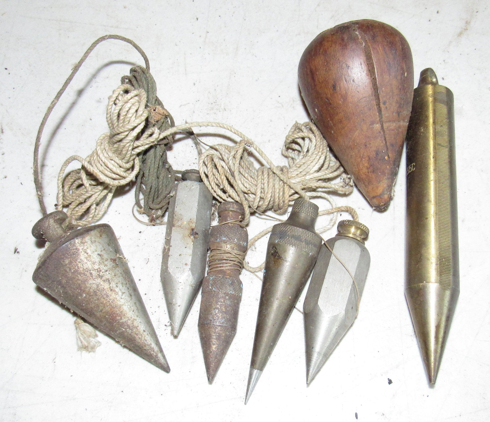 Plumb Bobs Incl Starrett 515C: Brass Starrett ( on far right) is approx 1 1/8" in diameter and 6 7/8" long