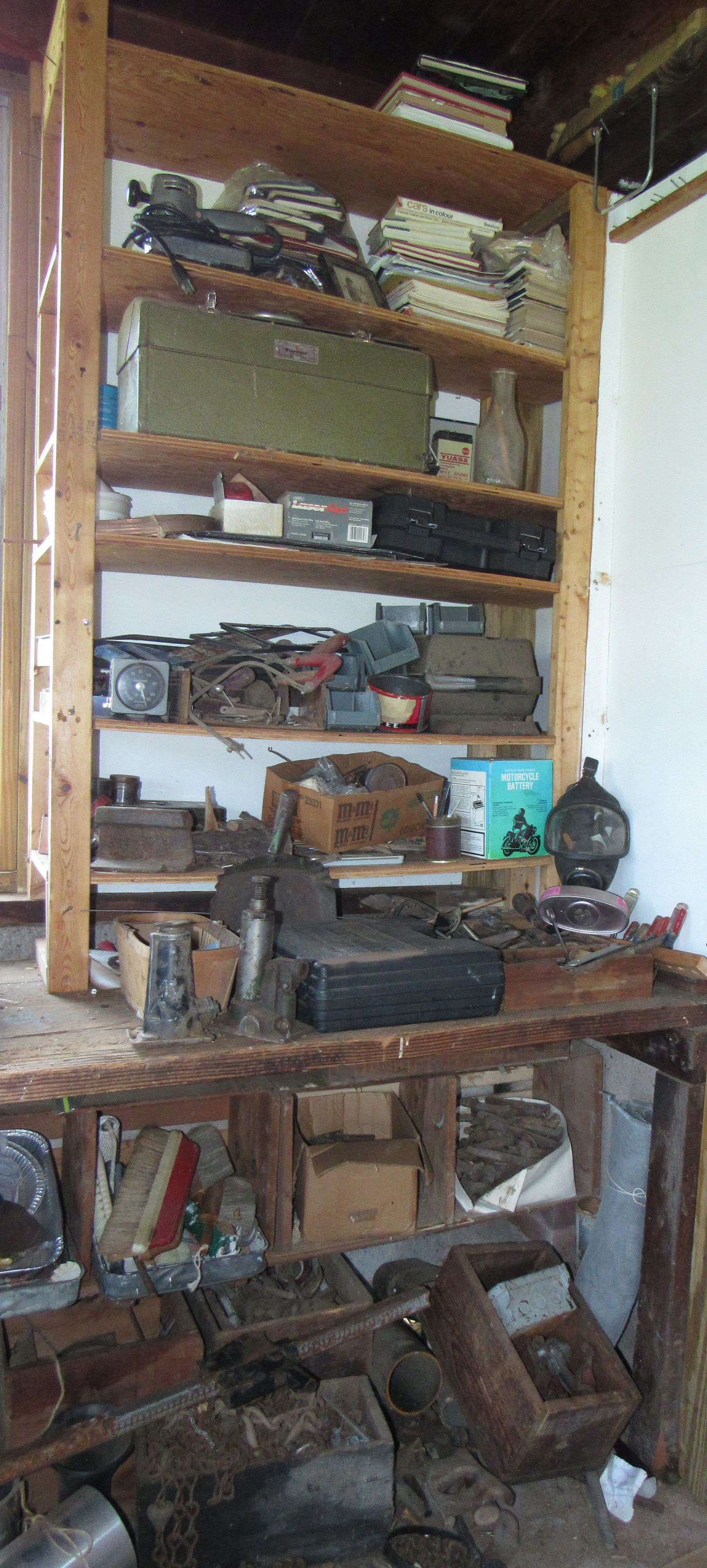 Shelf Contents Motorcycle Battery Tools & Misc: Lot includes all pictured on shelf and under workbench. All the tool boxes are empty, except the craftsman drill box.