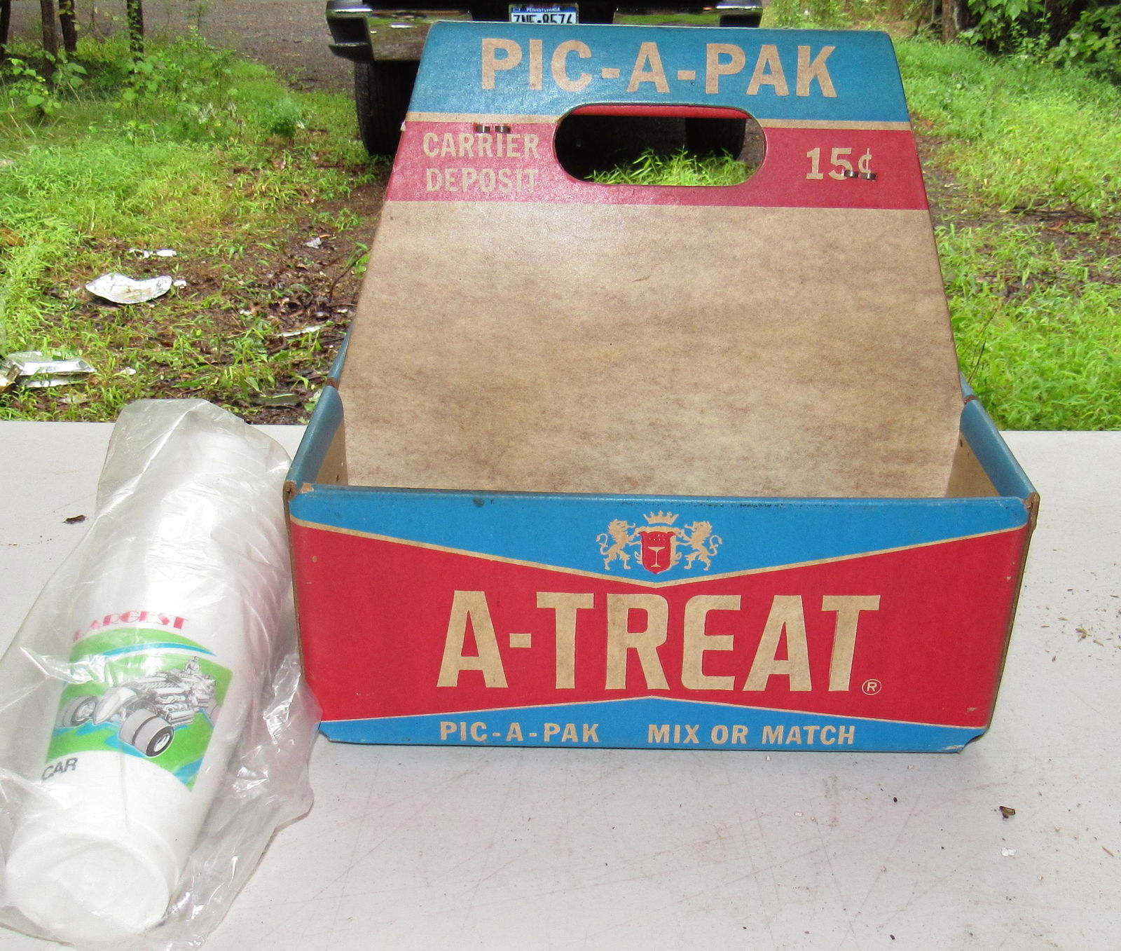 A-Treat Bottle Carrier: Also includes plastic Coke cups, Carrier is approx 8" x 11 1/2" x 11" tall.