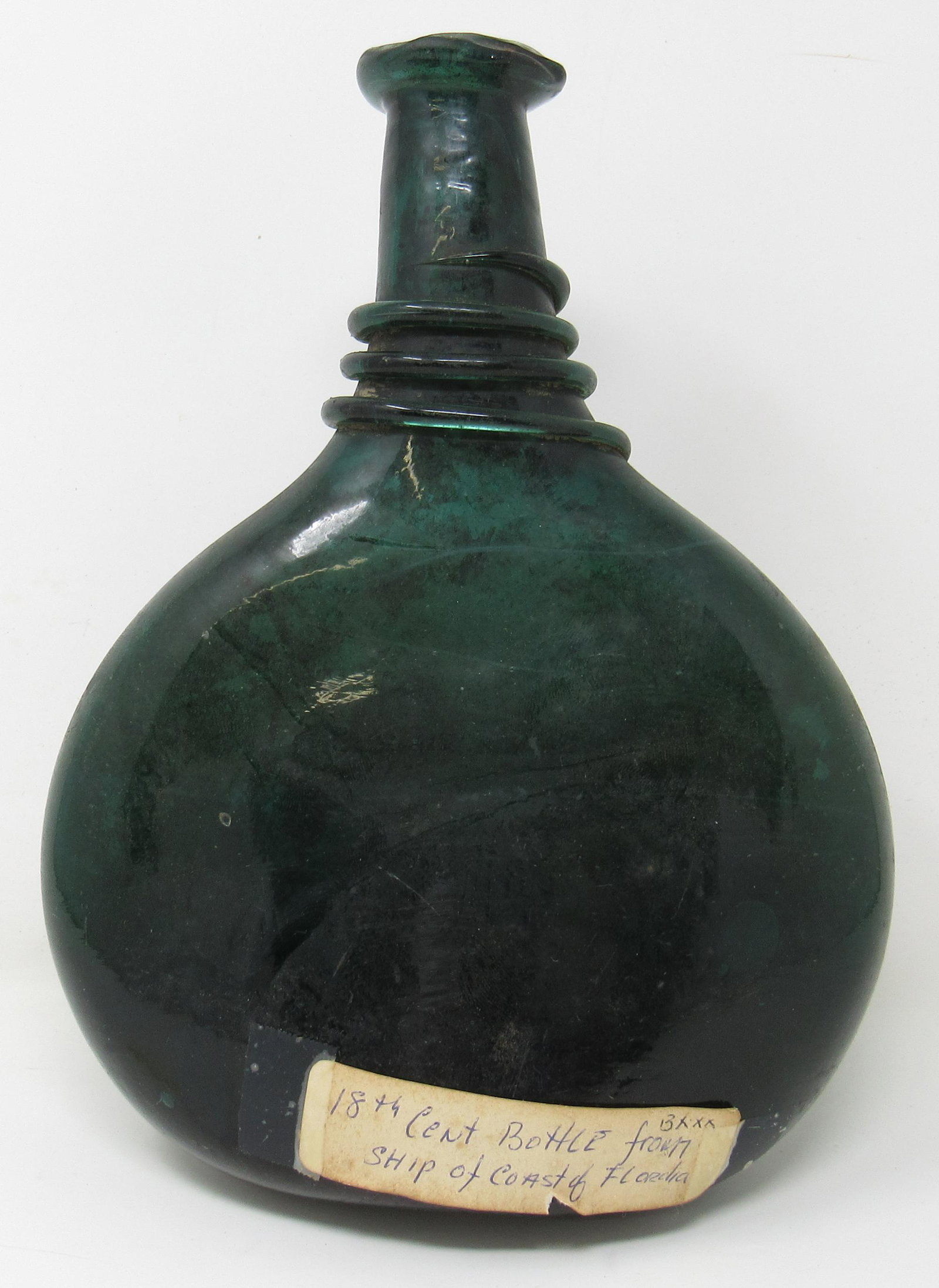 Antique Onion Bottle: Approx 3 1/4" x 7" x 9 1/2" tall. It does not sit flat. Label on it reads " 18th Century from Ship of Coast of Florida"