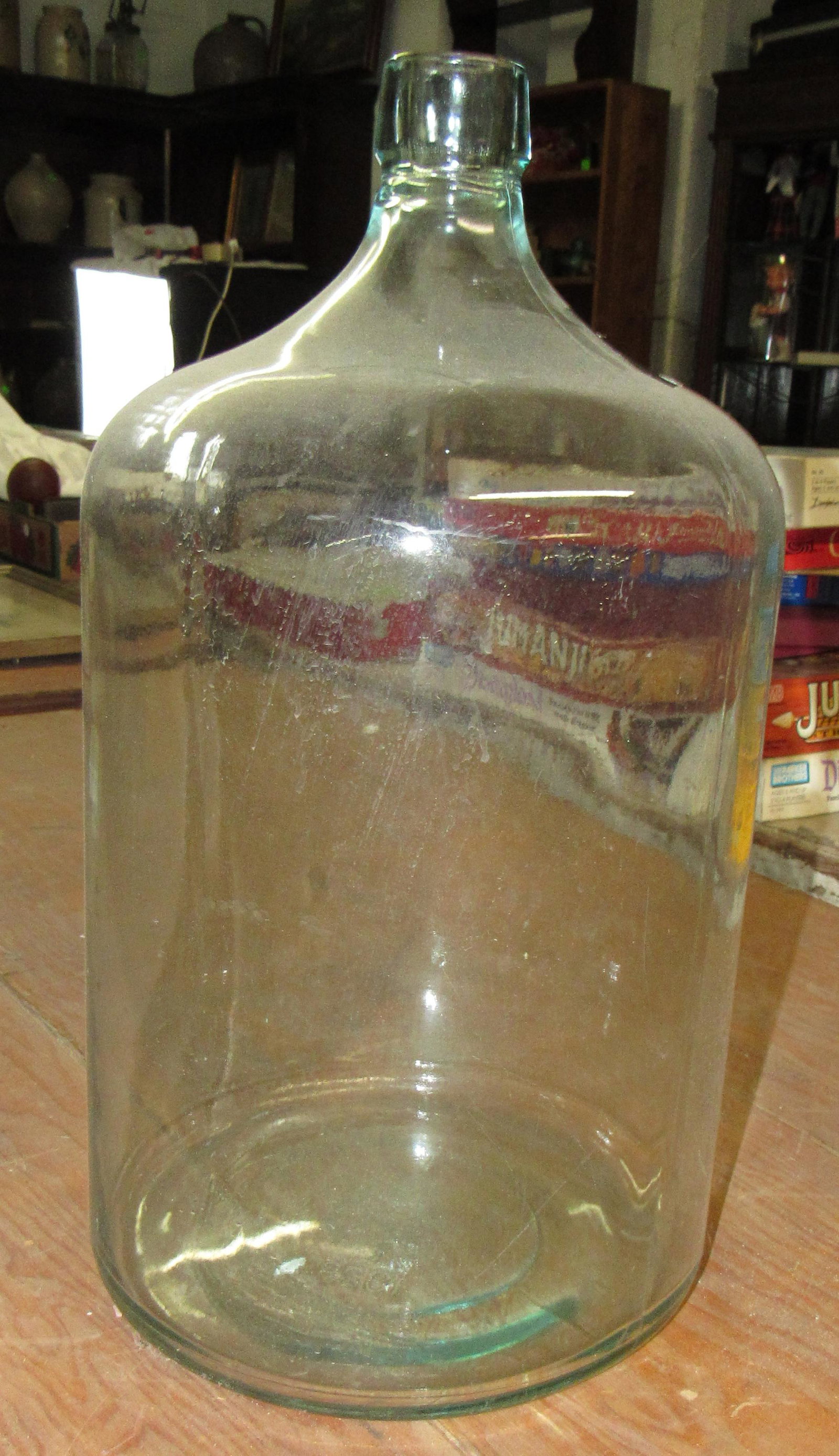 Glass Water Bottle: Approx 11" in diameter and 20 1/2" tall