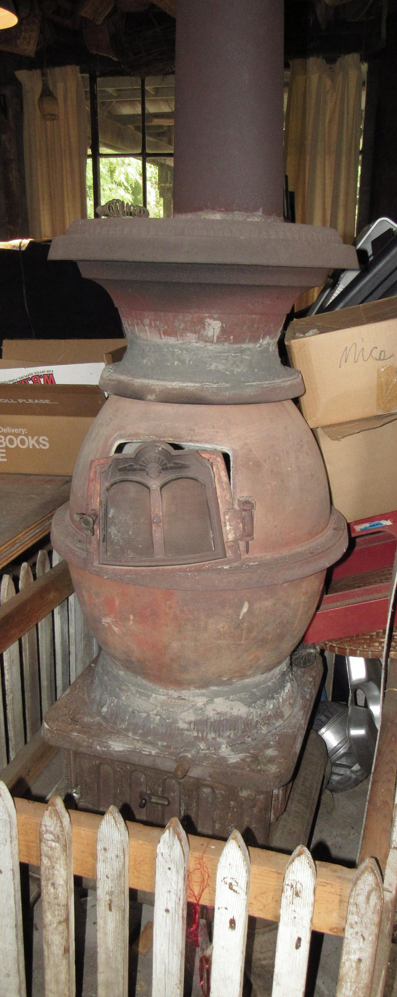 Cast Iron Pot Belly Stove: Approx 21" in diameter and 55" tall