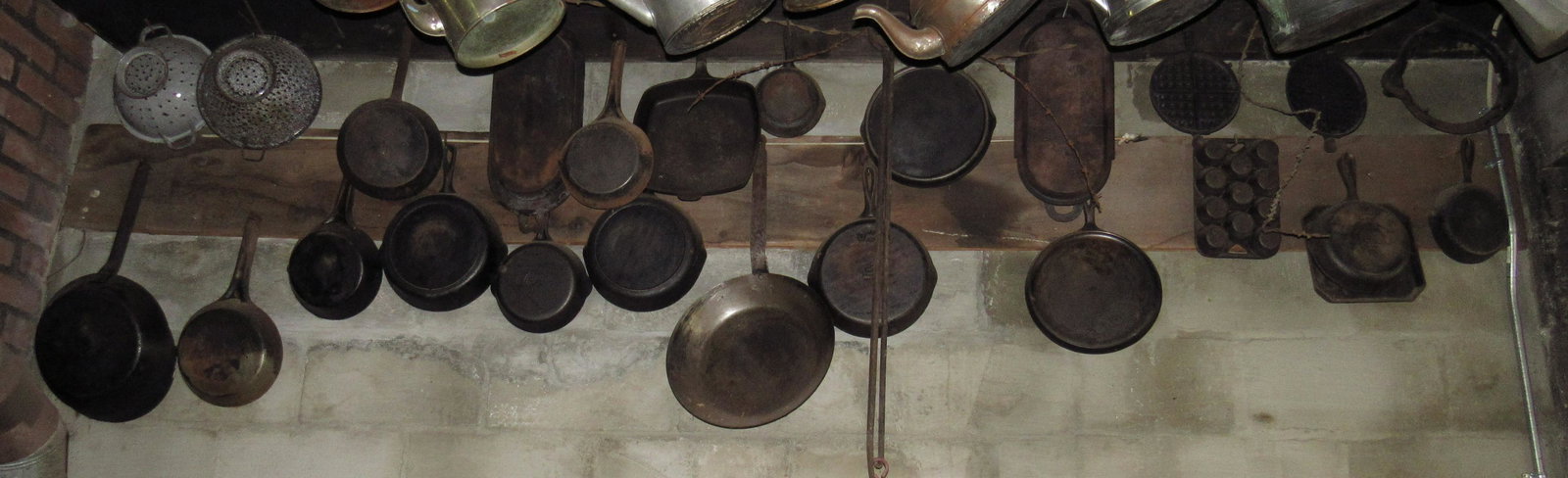 Cast Iron Skillets Muffin Pans Waffle Irons Griswold: Misc Cast Iron . Lot includes all the cast iron on the wall. It does not include the teapots or baskets hanging from rafters.