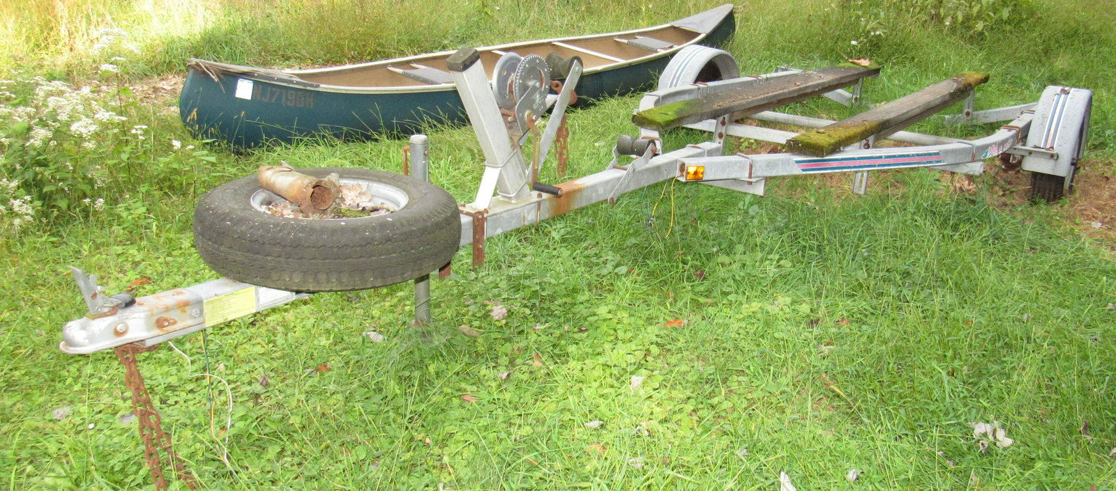Piggy Back Boat Trailer: Approx 76" wide inside fender to inside fender and 13'7" from end of trailer to winch. No trailer
