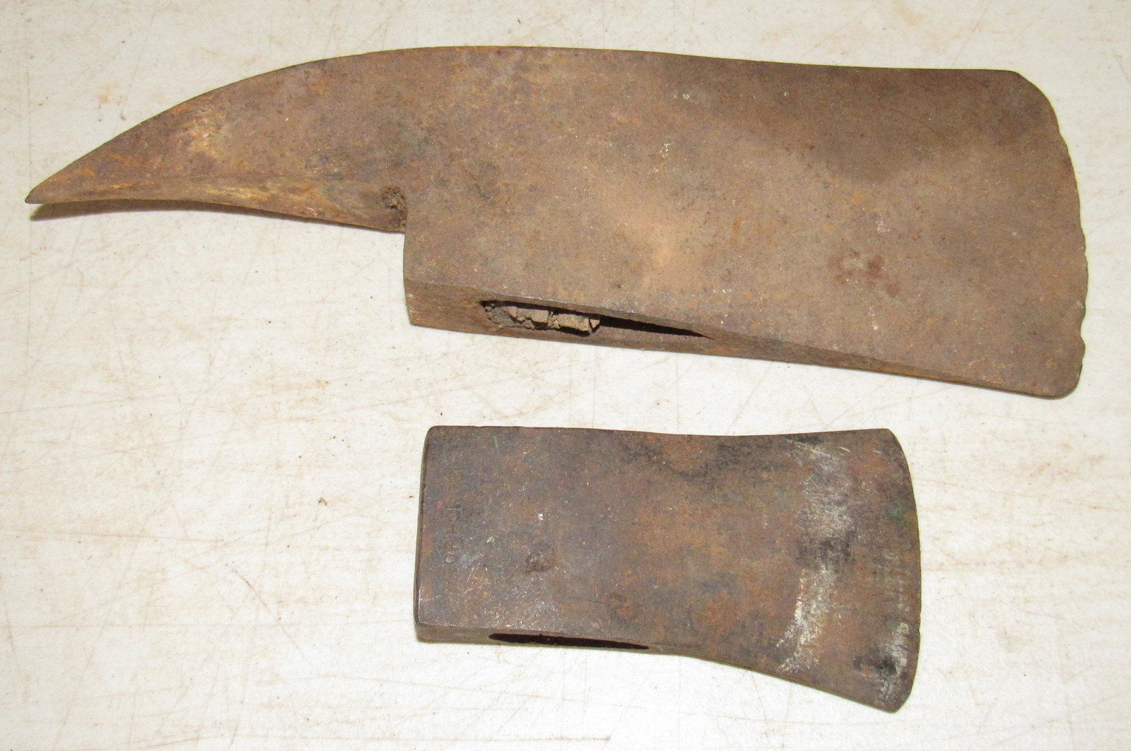 Axe Heads: Largest blade edge is approx 4 1/8" wide. Total length of head is approx 11 3/4"
