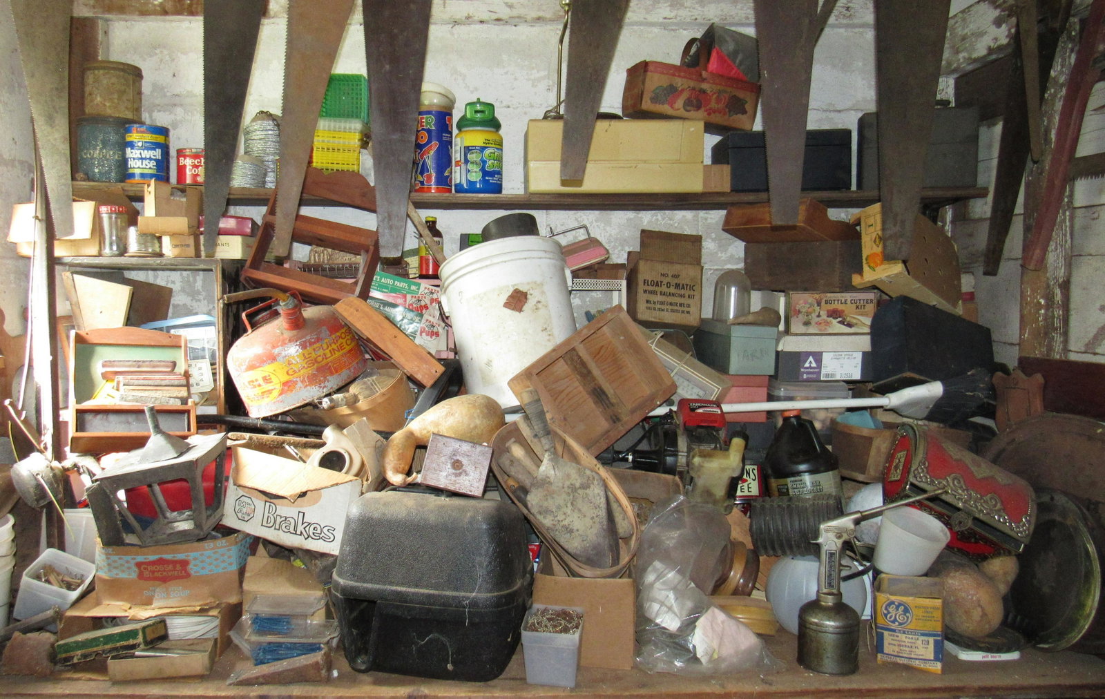Misc Workbench Contents: Lots includes everything on workbench, shelf above workbench, dresser, and stool. Does not include saws hanging. Take what you want and leave the rest