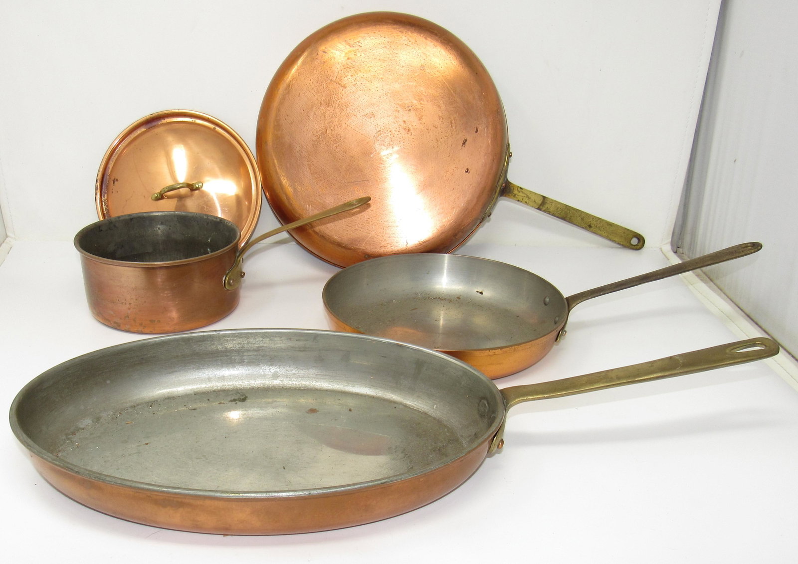 Copper Pots & Pans with Brass Handles Tagus: One marked Tagus. Largest is approx 10 1/4" in diameter. Lid does not fit any