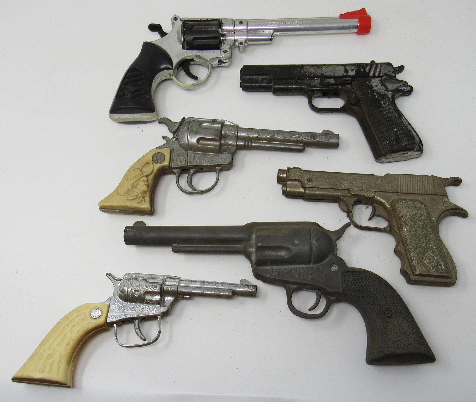 Cap Guns Incl 45 Smoker: 45 smoker is approx 11" long. Mist are plastic