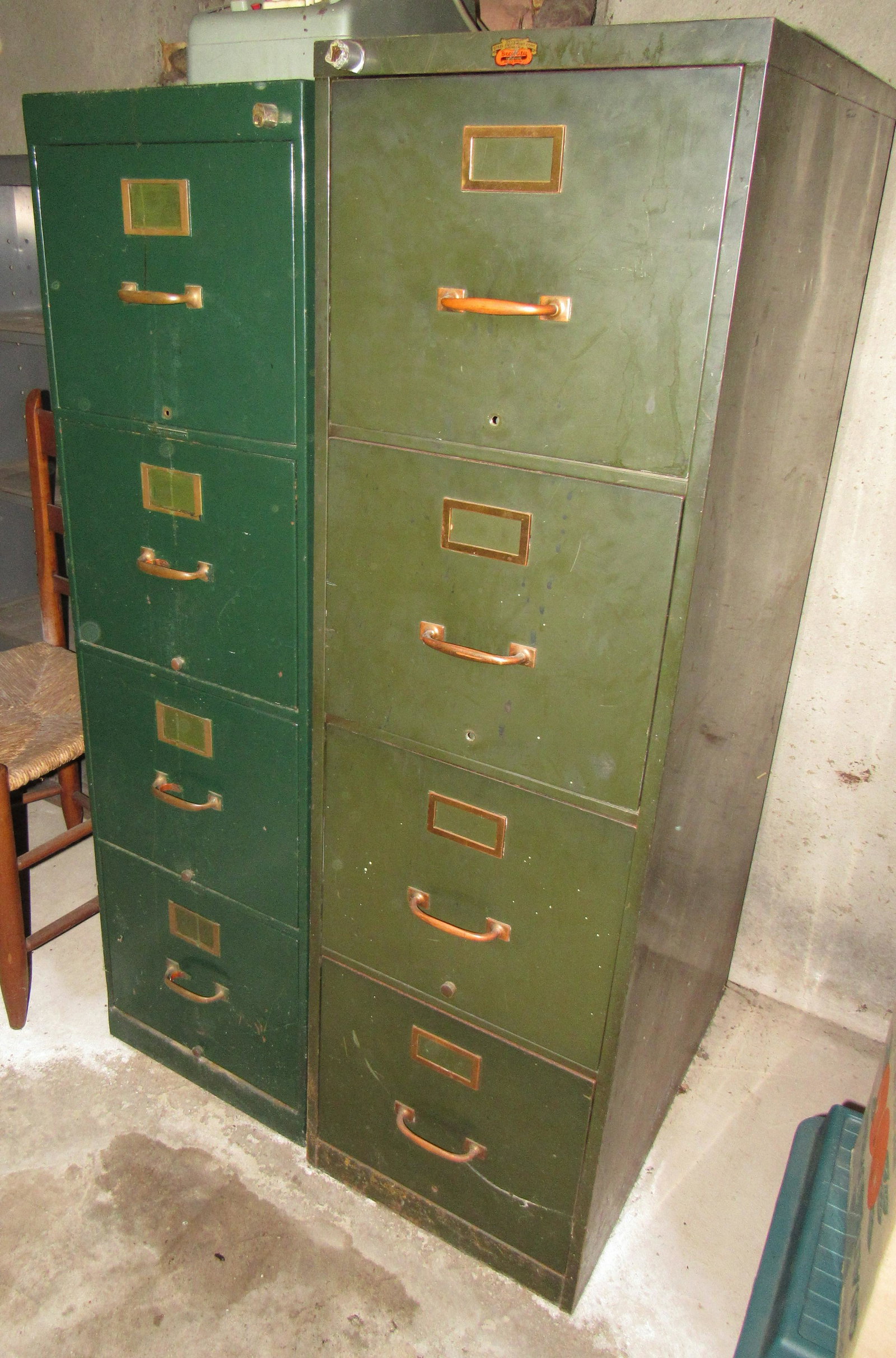 2 Metal Filing Cabinets: Largest is approx 15" x 25 1/2" x 52" tall. Drawers open. No keys