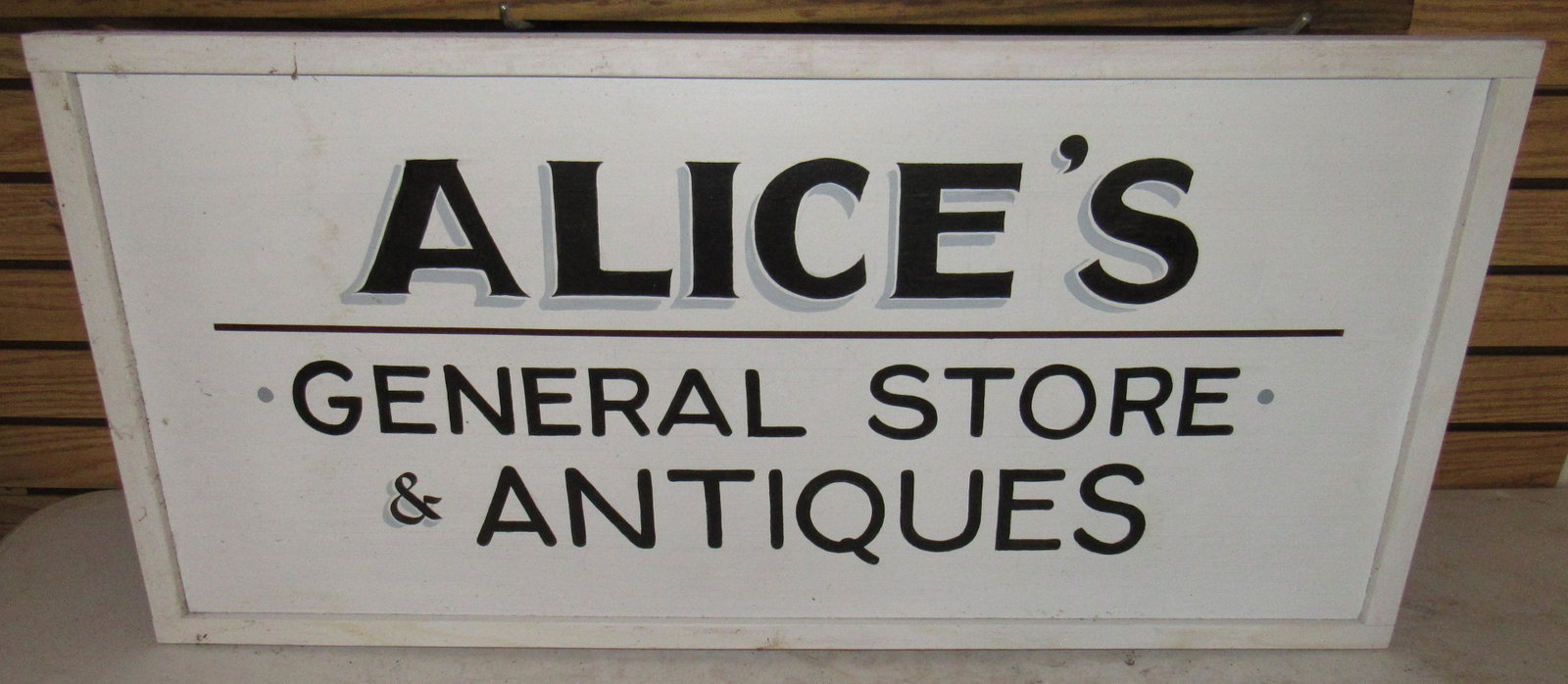 Alice's General Store & Antiques Sign: Approx 17 1/2" x 37 1/4" . Hand painted on wood