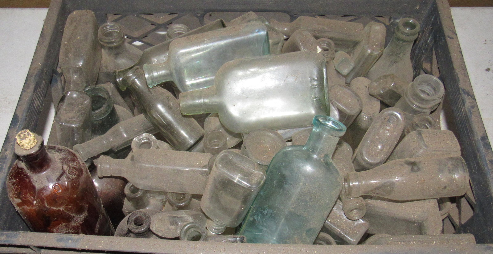 Milk Crate Filled with Misc Bottles: Getting all in crate