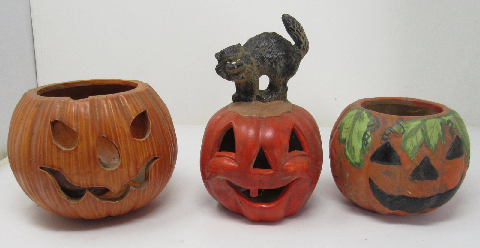 3 Vintage Ceramic Jack O Lanterns / Pumpkins: Tallest is approx 8" tall. One on far right is Holland Mold