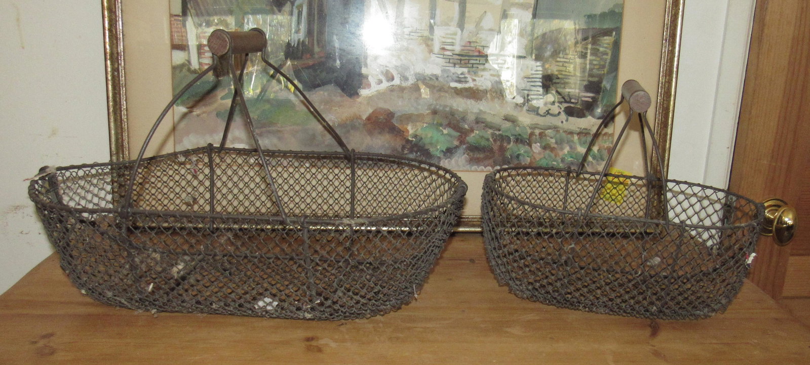 2 Wire Baskets: Largest is approx 11" by 19 1/4" by 12" to top of the handle.