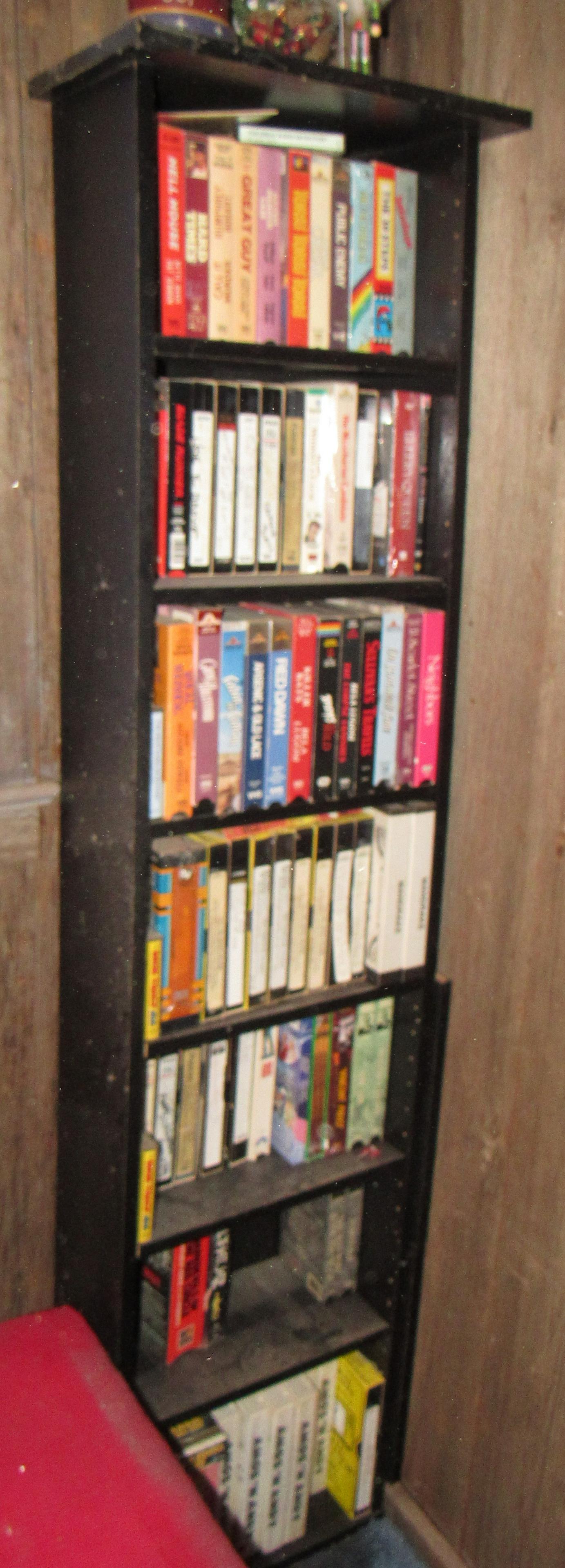 VHS Tapes and Shelf: Shelf is approx 9" x 17" x 64 1/2" tall. Take what you want and leave the rest
