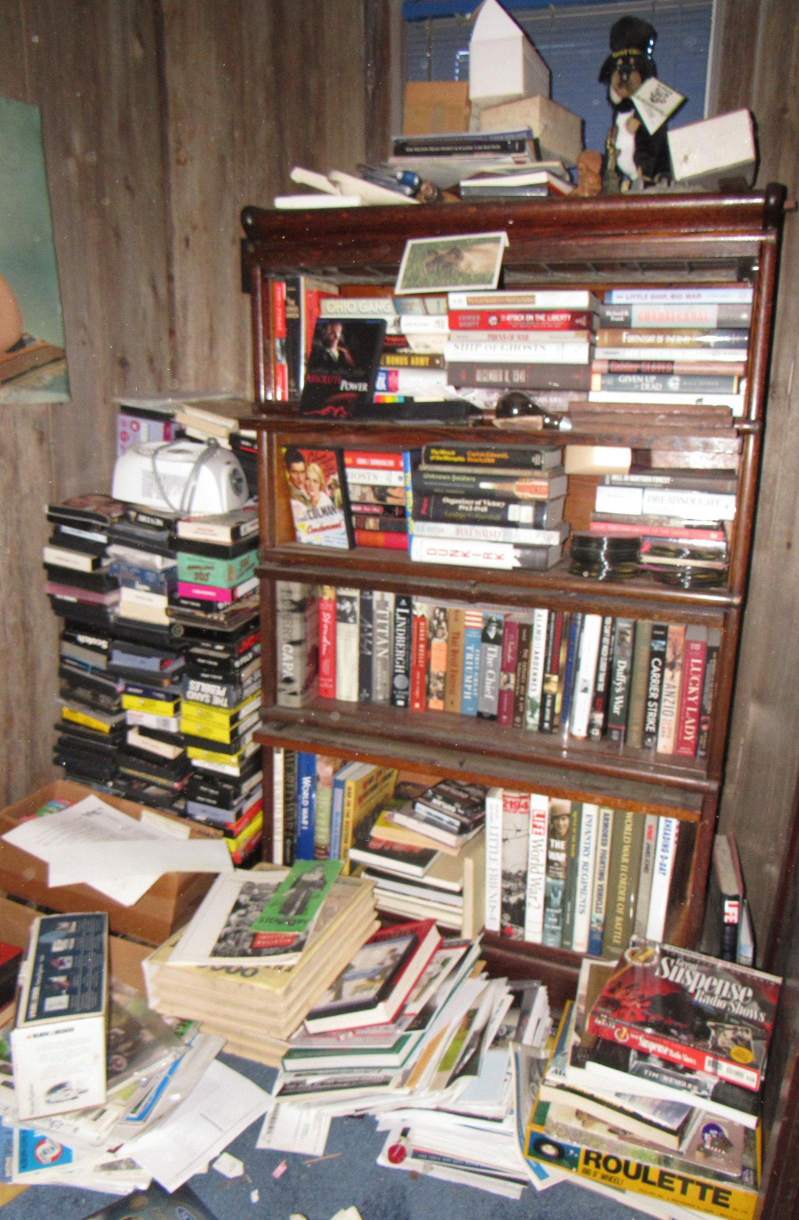 Military Misc Books & VHS Tapes: Getting all pictured in bookcase. Take what you want and leave the rest. Does not include bookcase. Must all be removed before noon !