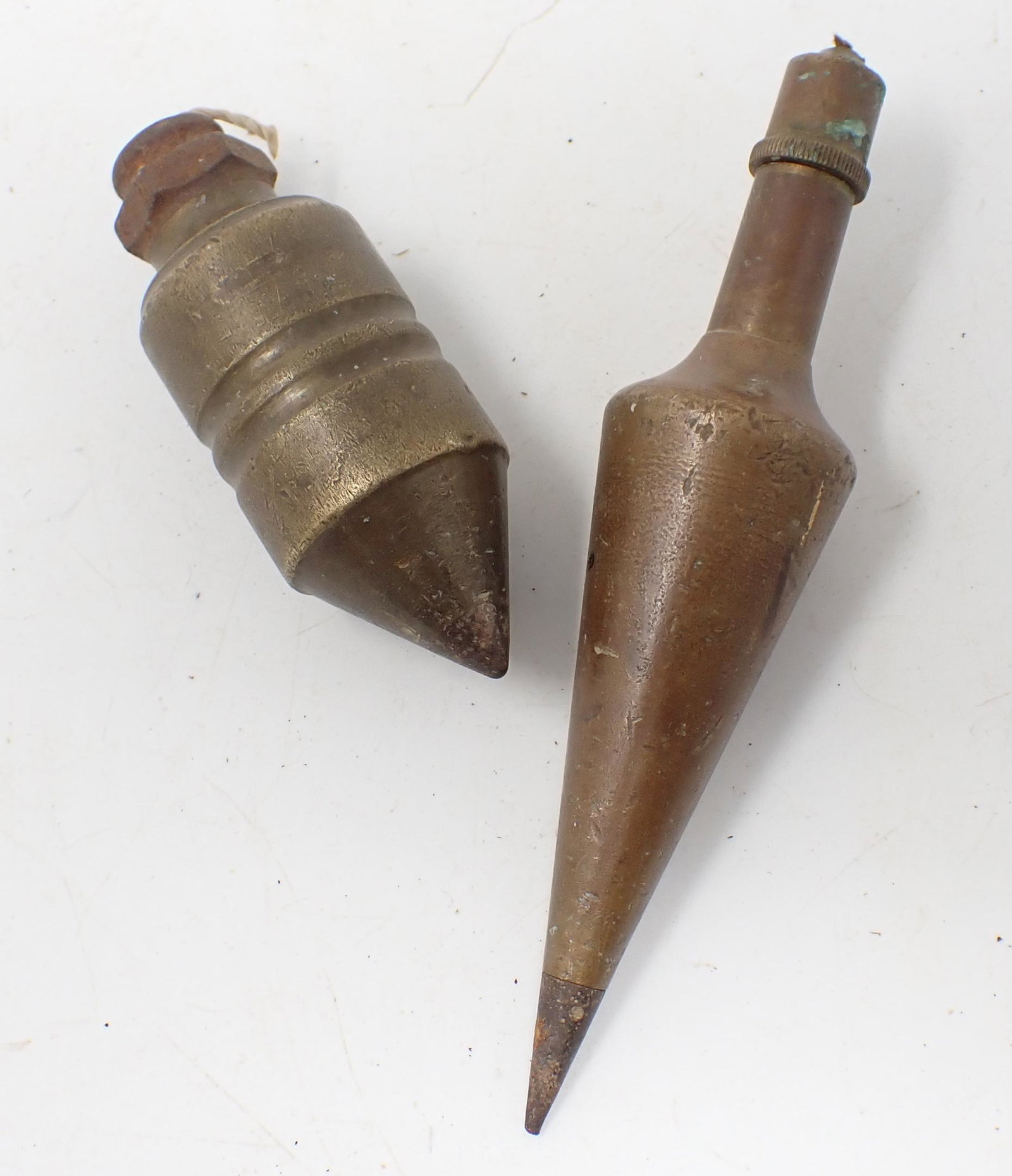 2 Brass Plumb Bobs: Longest is apprx 1 3/8" in diameter and 6 1/4" long