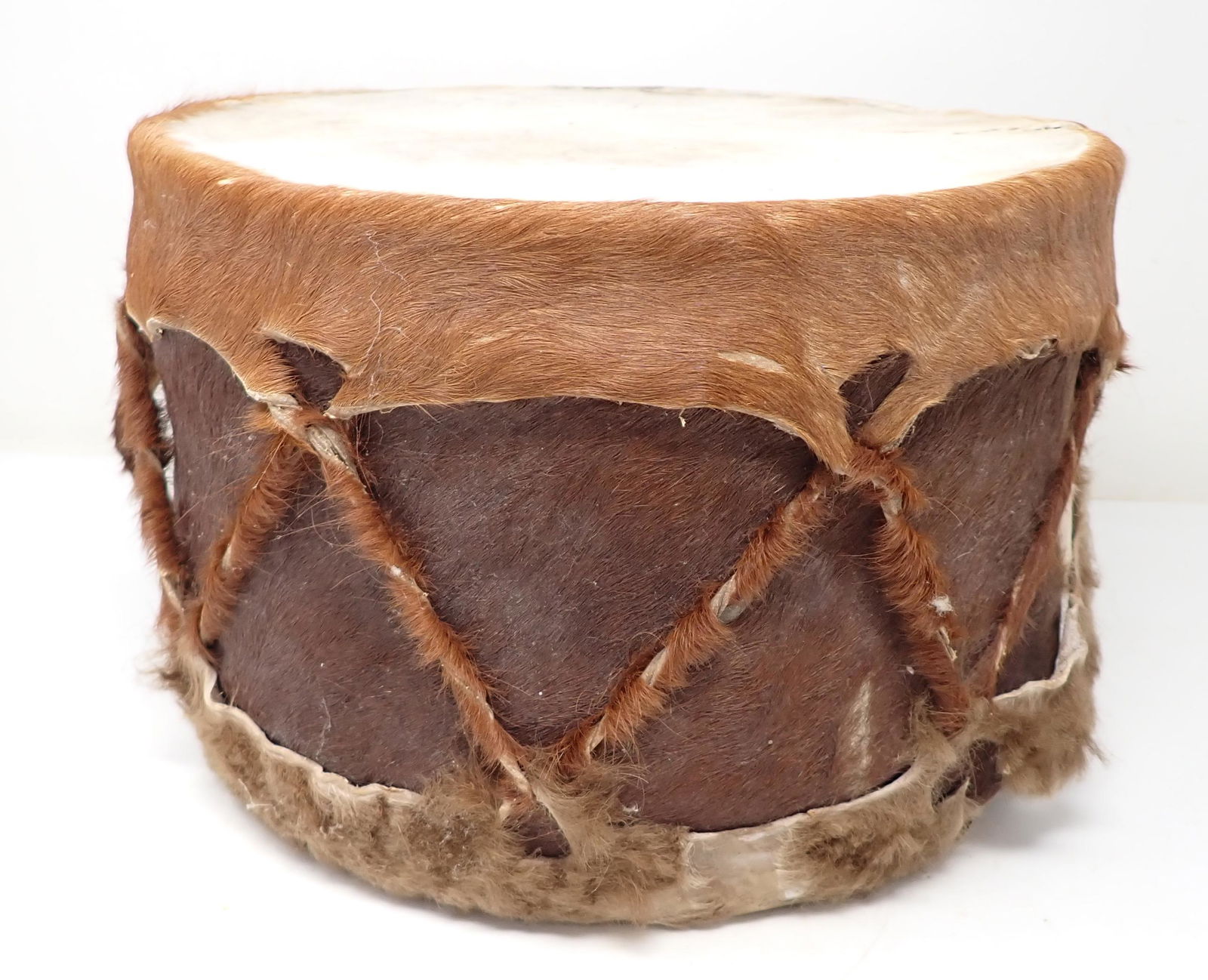 Cow Hide Drum: Approx 11" in diameter and 8 3/4" tall