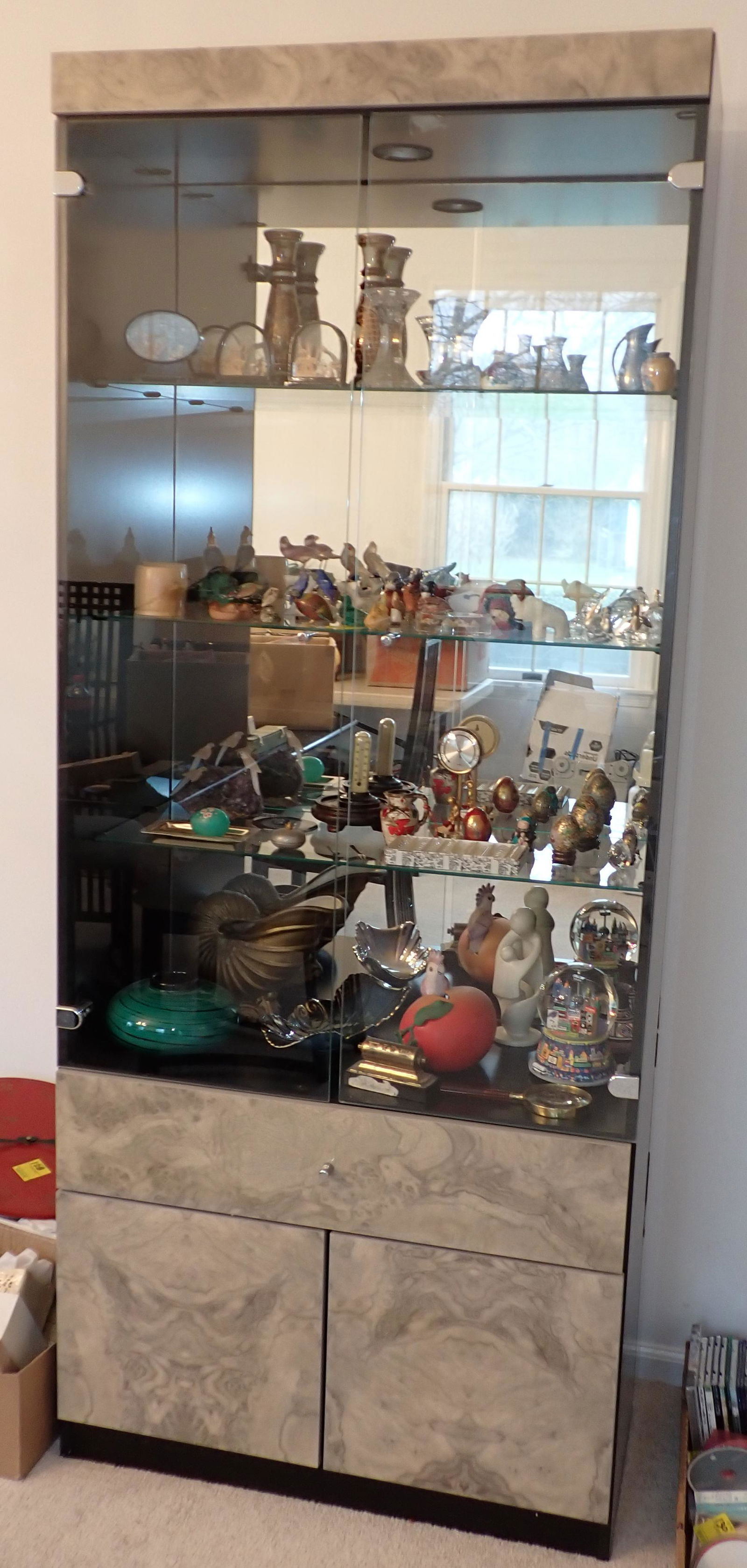 3 Piece Curio Cabinet: Middle section is approx 15 1/2" x 32 1/2" x 78" tall. Small sections are approx 15 1/2" x 18" x 78" tall. Take what you want and leave the others. Does not include items in them. Pick up after Noon