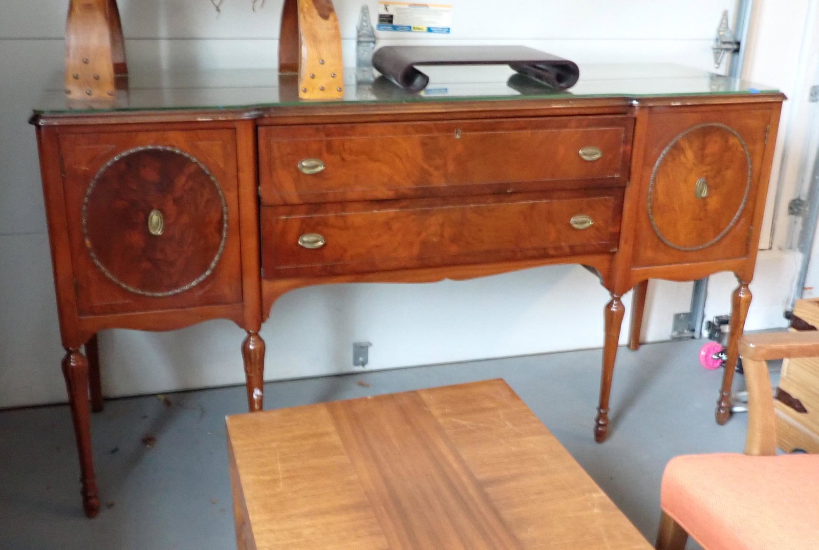 Sideboard: Approx 22" x 70 1/2" x 39 1/2" tall. Has glass on top. Does not include items on it